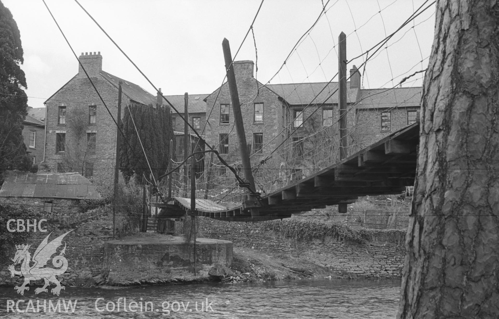 Digital copy of a black and white negative showing suspension wooden footbridge across the Teifi to Dol-llan. Photographed in April 1963 by Arthur O. Chater from Grid Reference SN 4193 4074, looking west north west.