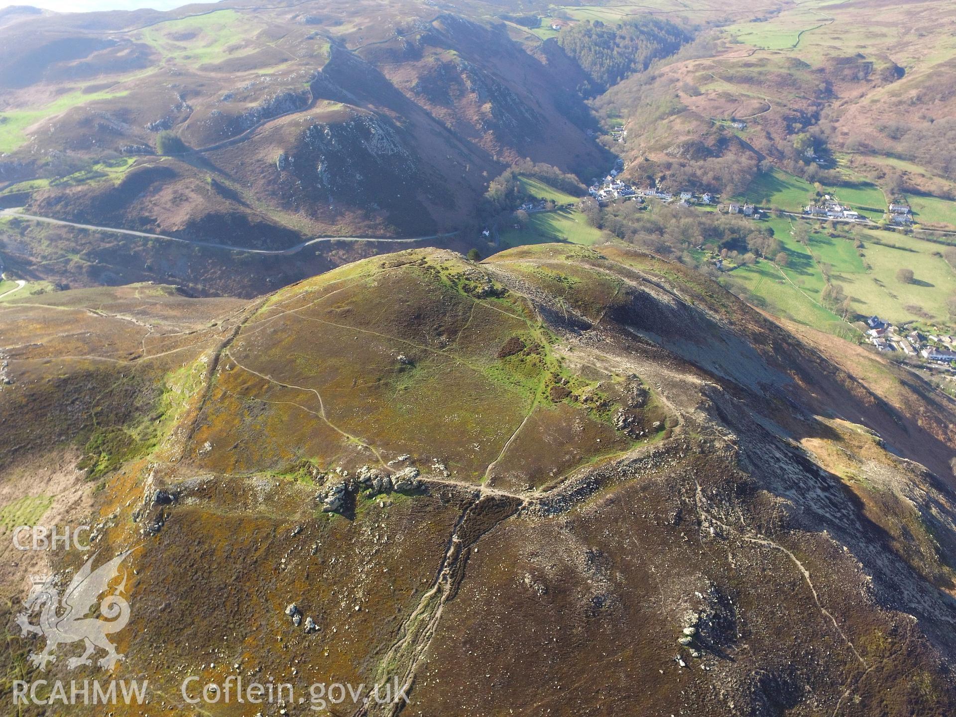 Colour photo showing aerial view of Dinas Allt Wen, a hillfort above Dwygyfylchi, Penmaenmawr, taken by Paul R. Davis, 19th April 2018.