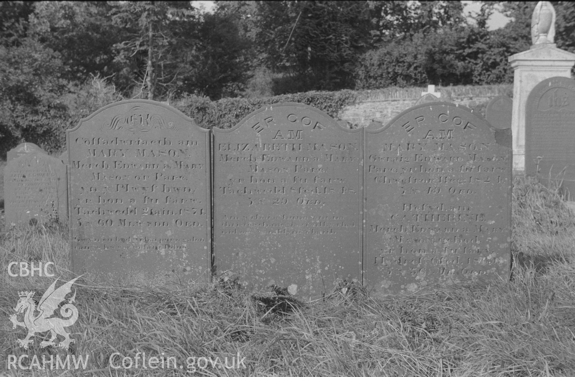 Digital copy of a black and white negative showing gravestones in memory of members of the Mason family at St. Non's Church, Llanerchaeron. Photographed by Arthur O. Chater in September 1966.