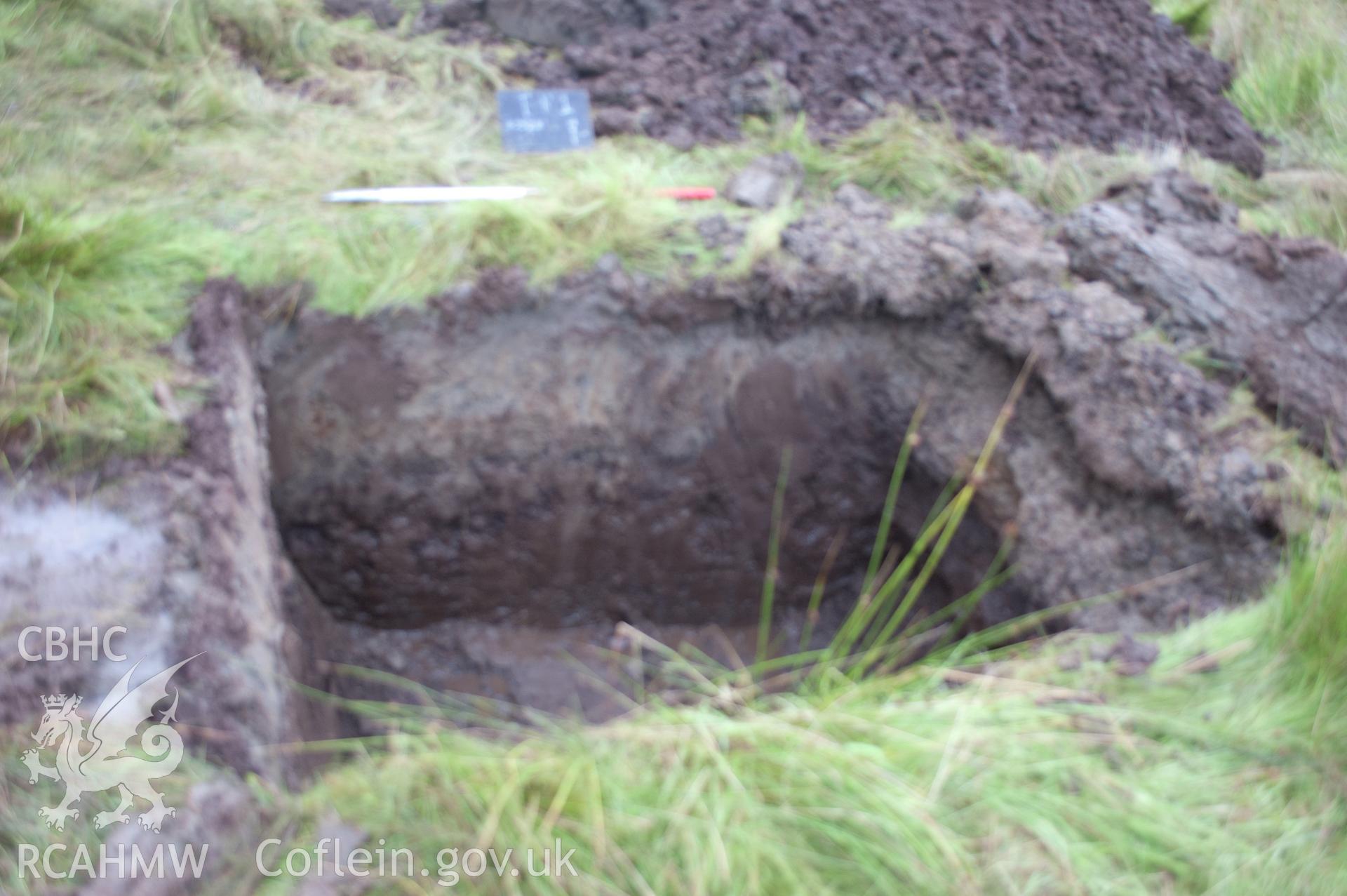 Digital photograph showing view from west of launch pit 1 post excavation. Photographed during Gwynedd Archaeological Trust's archaeological watching brief of water main renewal in Dolgellau on 28th July 2017. Project no. G2528.