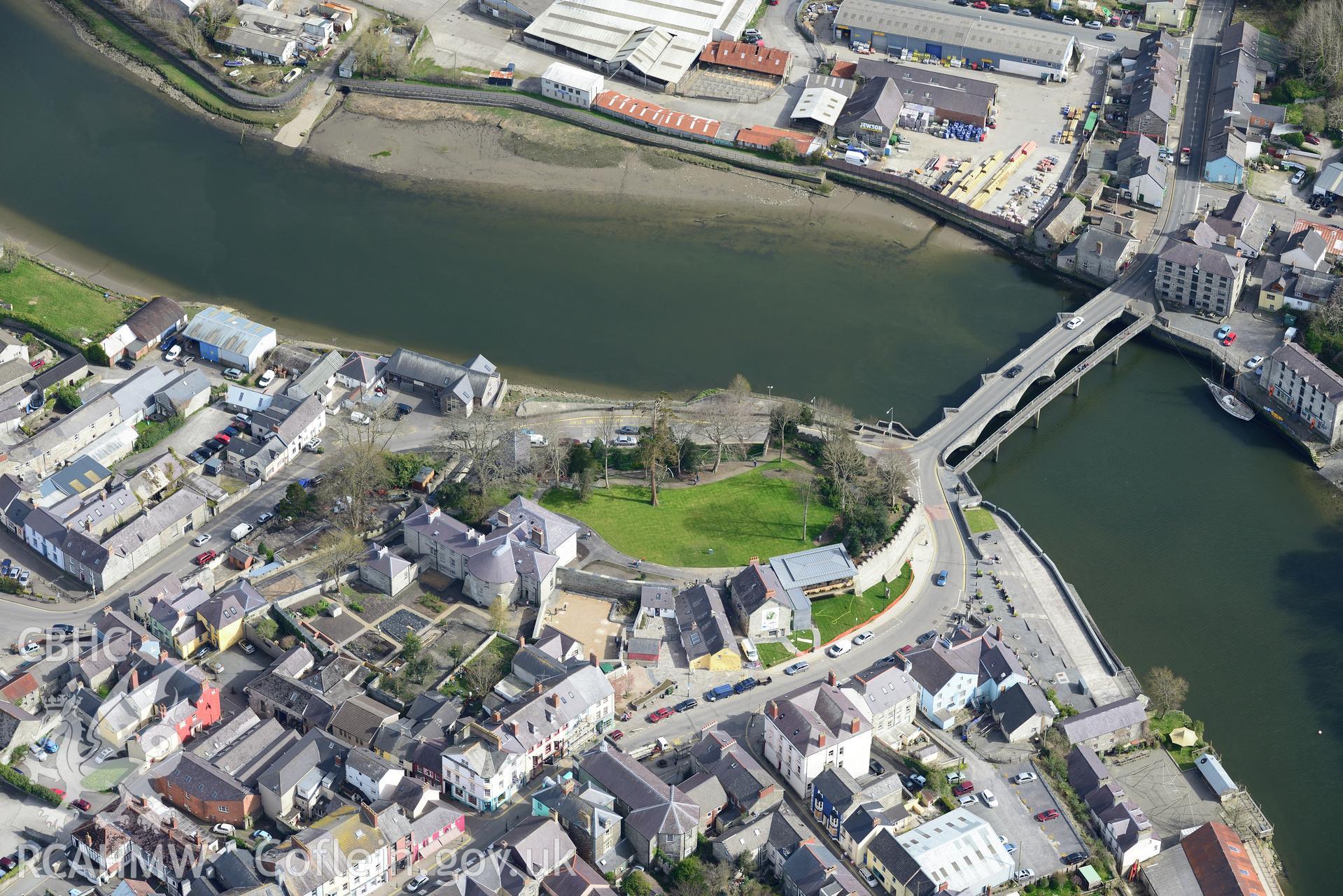 Cardigan Town, Castle, Castle House, Castle Gardener's Cottage, Castle Cottages, Cardigan Bridge, Harbour, Warehouse, Mercantile Wharf and Old Shire Hall. Oblique aerial photograph taken during the Royal Commission's programme of archaeological aerial reconnaissance by Toby Driver 15th April 2015.