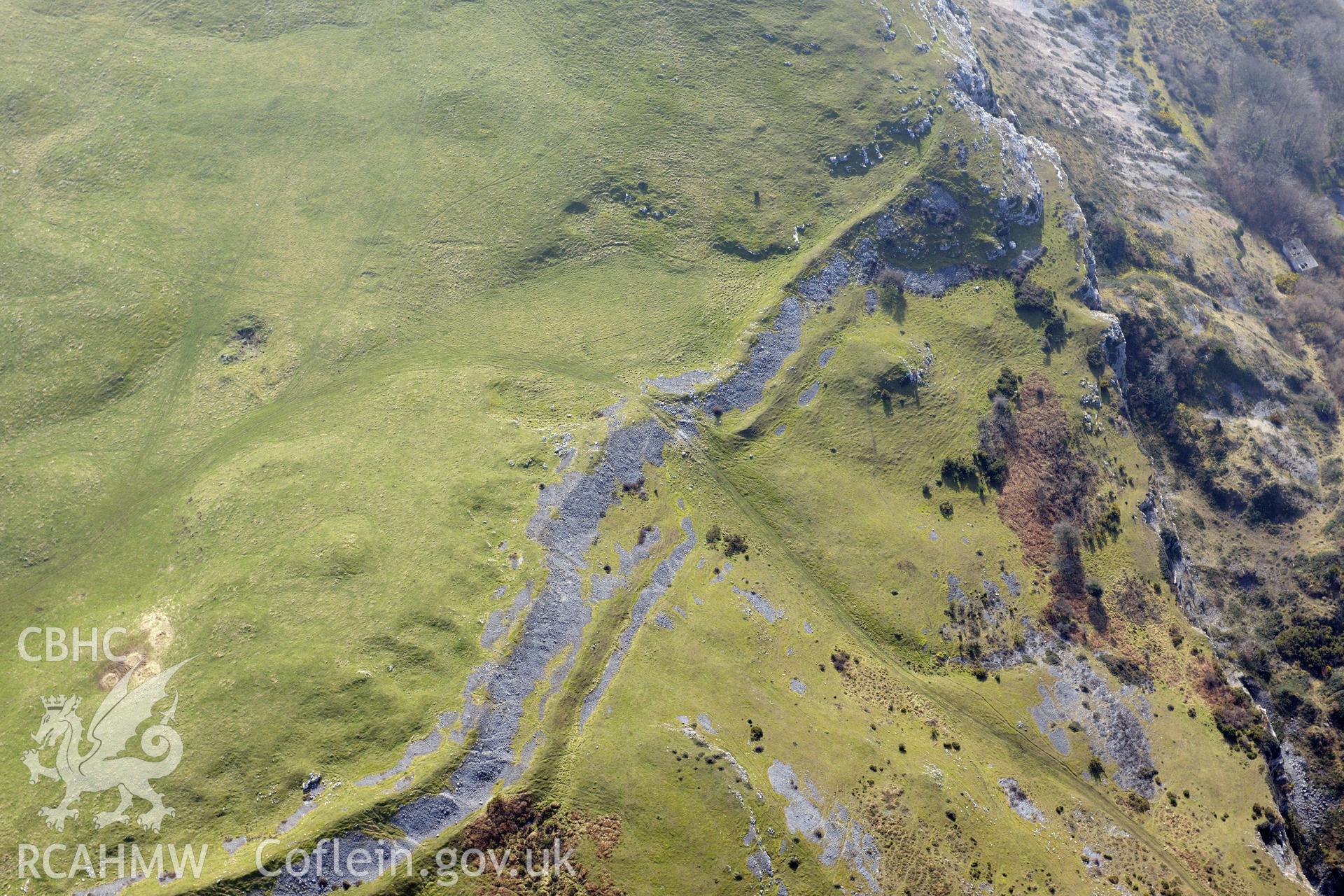 Pen-y-Corddyn-Mawr hillfort, Abergele. Oblique aerial photograph taken during the Royal Commission?s programme of archaeological aerial reconnaissance by Toby Driver on 28th February 2013.