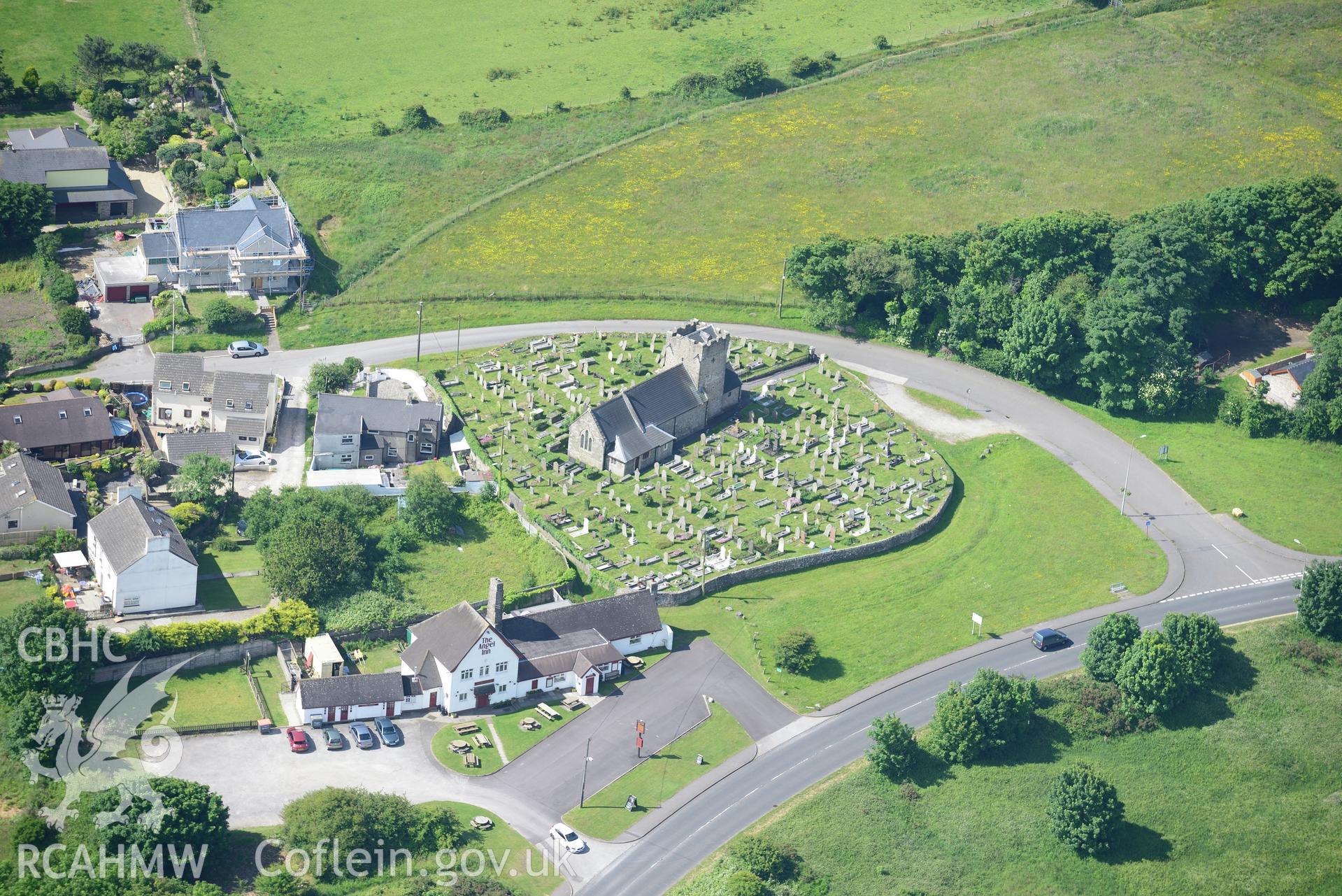 St. Mary Magdalen's Church and The Angel Inn, Mawdlam. Oblique aerial photograph taken during the Royal Commission's programme of archaeological aerial reconnaissance by Toby Driver on 19th June 2015.