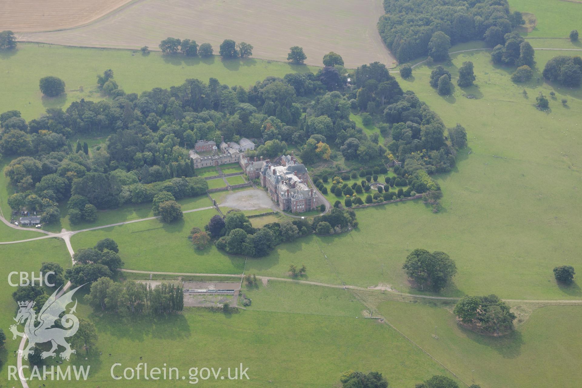 Hall, garden, Venetian garden, and First World War practise trenches, Kinmel Park, Bodelwyddan. Oblique aerial photograph taken during the Royal Commission's programme of archaeological aerial reconnaissance by Toby Driver on 11th September 2015.