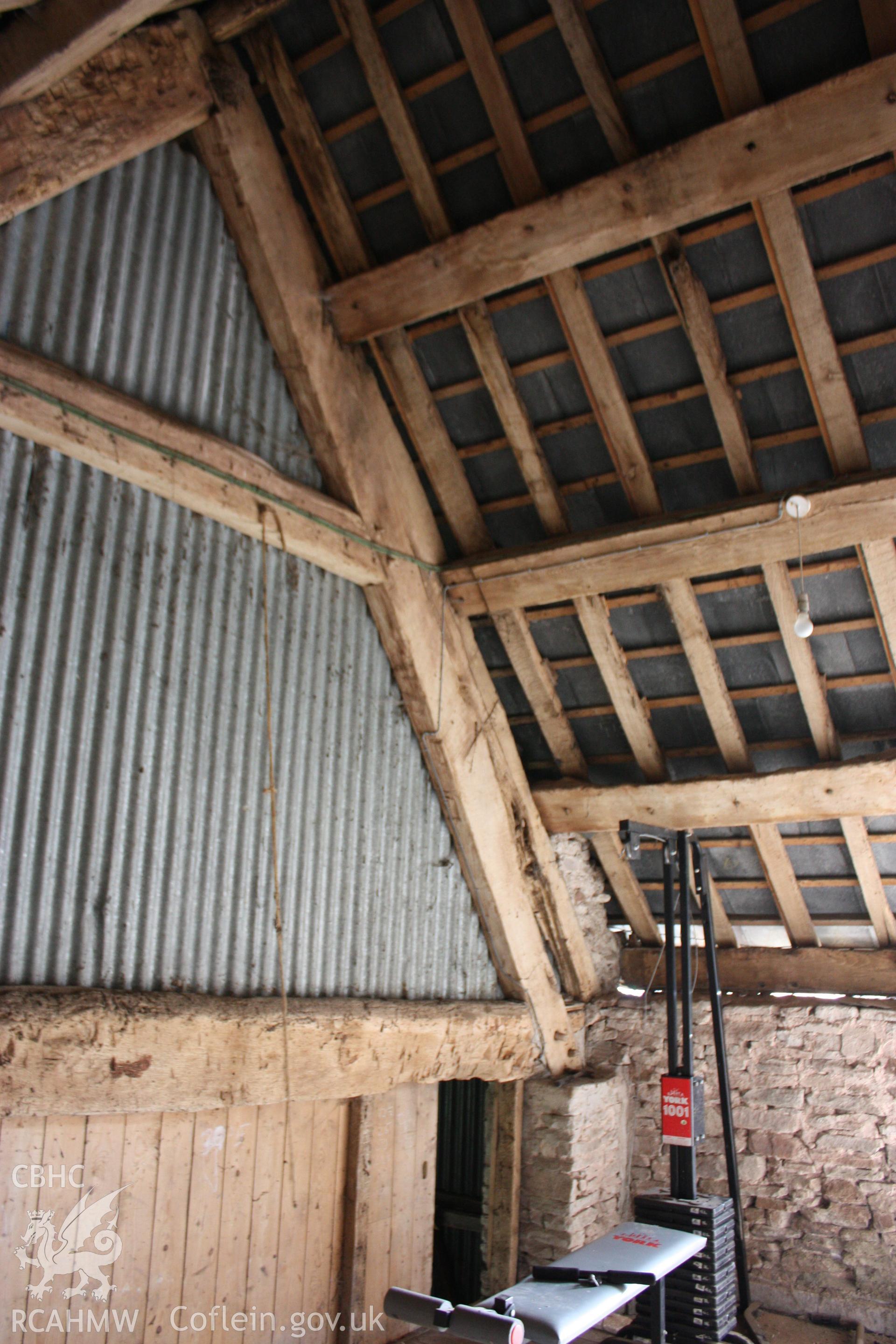 Internal view of wooden beams and corrugated iron roof at Maes Mawr. Photographic survey of Marian Mawr in Cwm, Denbighshire by Geoff Ward on 20th August 2010.
