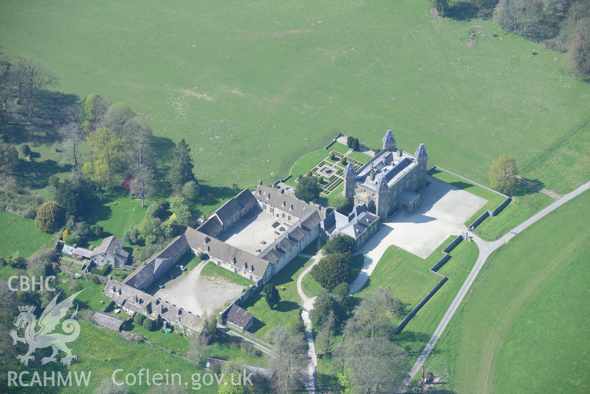 Newton House, Inner Courtyard, fountain, park, grounds and garden and WW2 Military Camp . Oblique aerial photograph taken during the Royal Commission's programme of archaeological aerial reconnaissance by Toby Driver on 21st April 2015