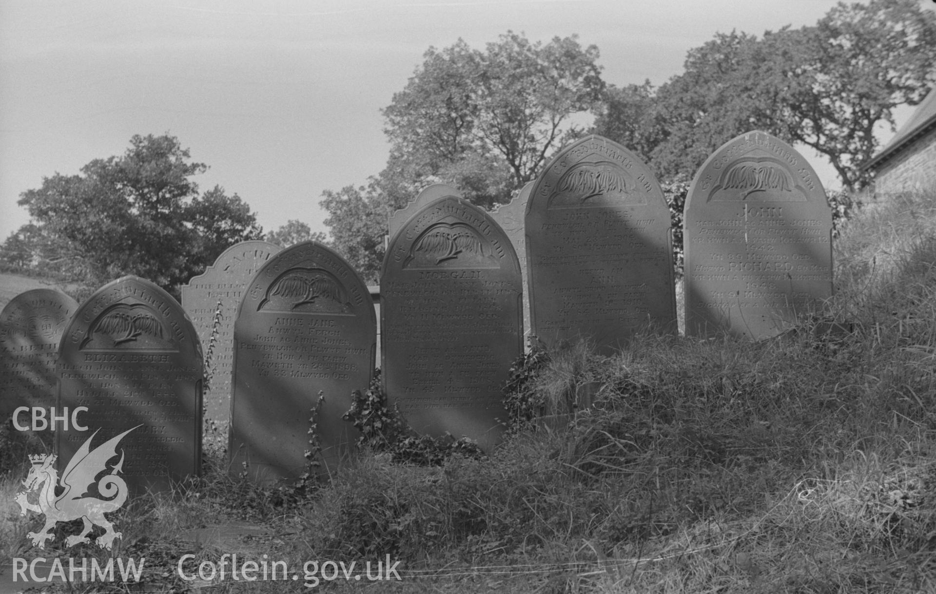 Digital copy of a black and white negative showing view of gravestone in memory of the Jones family of Peneblwch or Penybwlch at St. Non's Church, Llanerchaeron. Photographed by Arthur O. Chater in September 1966.