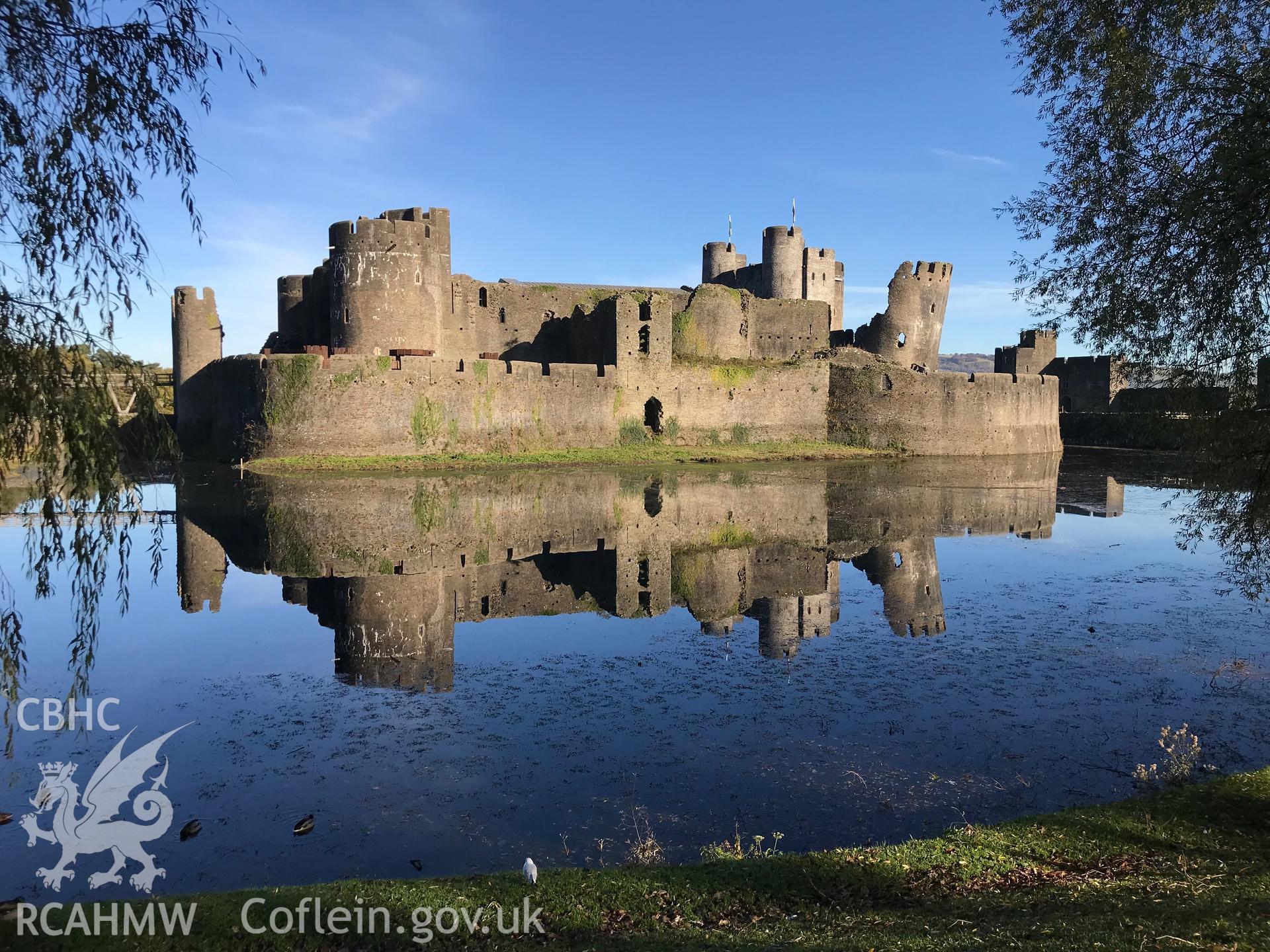 View of Caerphilly Castle and the surrounding moat. Colour photograph taken by Paul R. Davis on 2nd November 2018.