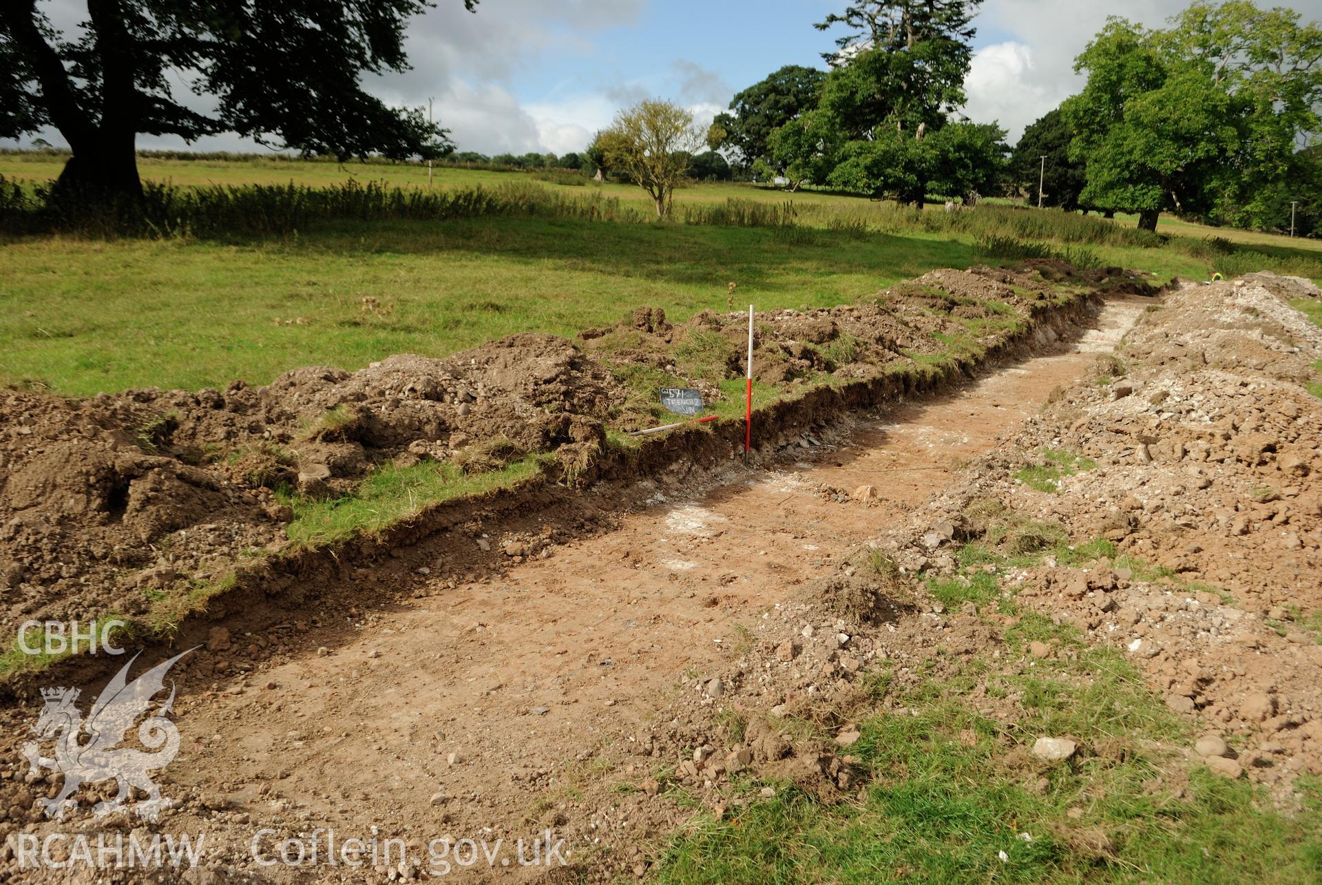 Location shot from the east north east of Trench 2. Photographed during archaeological evaluation of Kinmel Park, Abergele, conducted by Gwynedd Archaeological Trust on 24th August 2018. Project no. 2571.