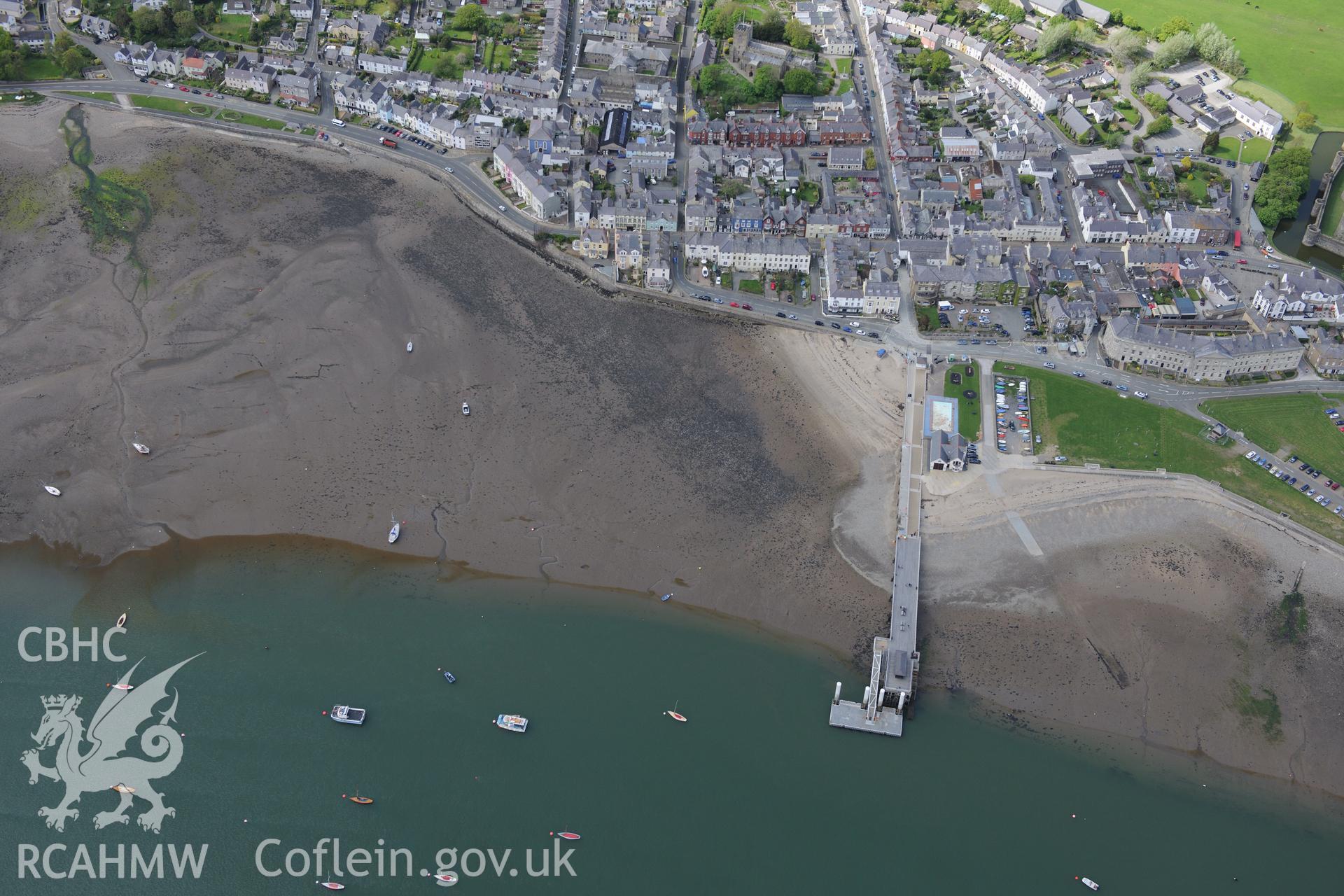 The town of Beaumaris, including Beaumaris pier and Beaumaris lifeboat station. Oblique aerial photograph taken during the Royal Commission?s programme of archaeological aerial reconnaissance by Toby Driver on 22nd May 2013.