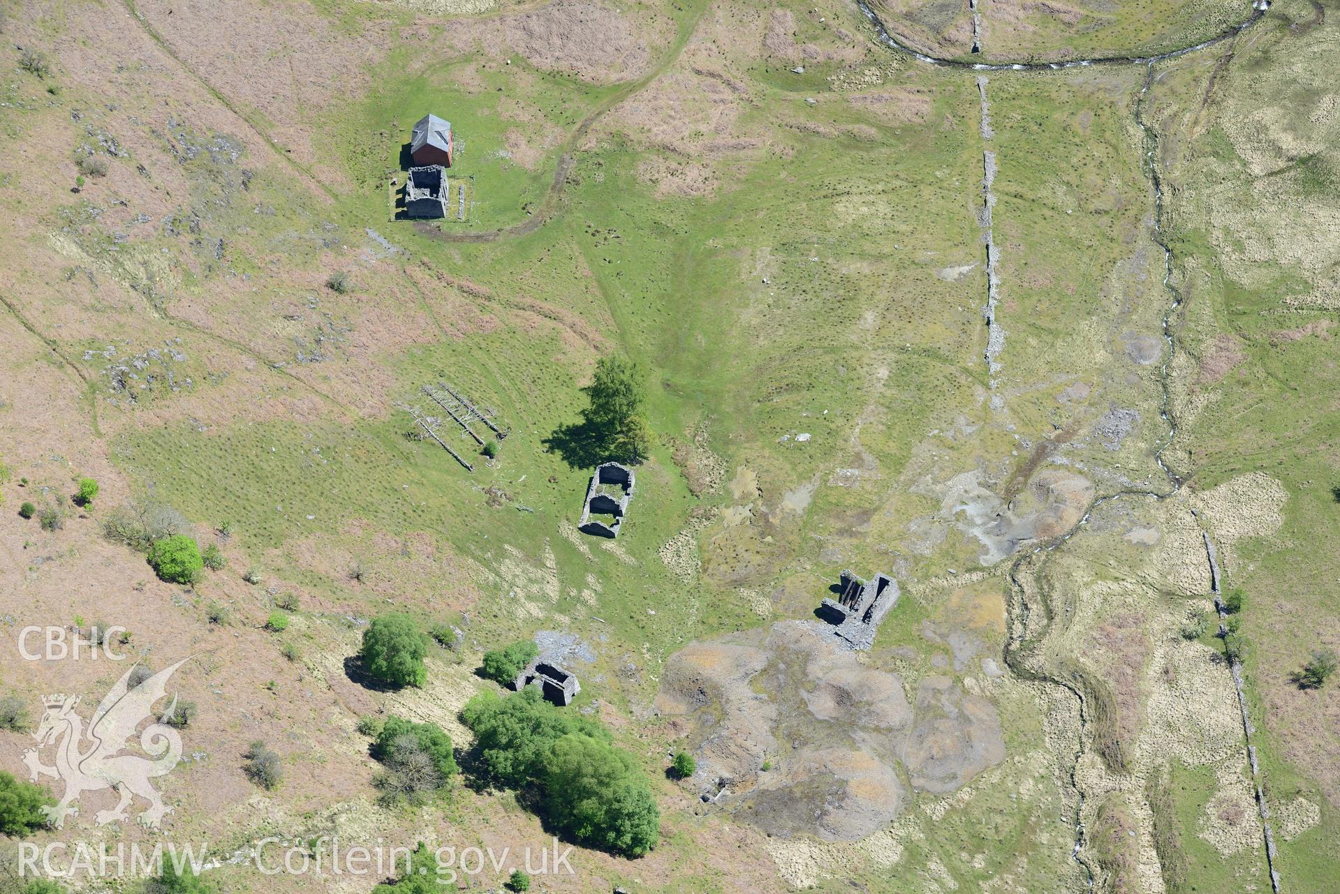 Cwm Elan lead mine complex, including the remains of a house, office, quarry, mine shaft and wheel pit. Oblique aerial photograph taken during the Royal Commission's programme of archaeological aerial reconnaissance by Toby Driver on 3rd June 2015.