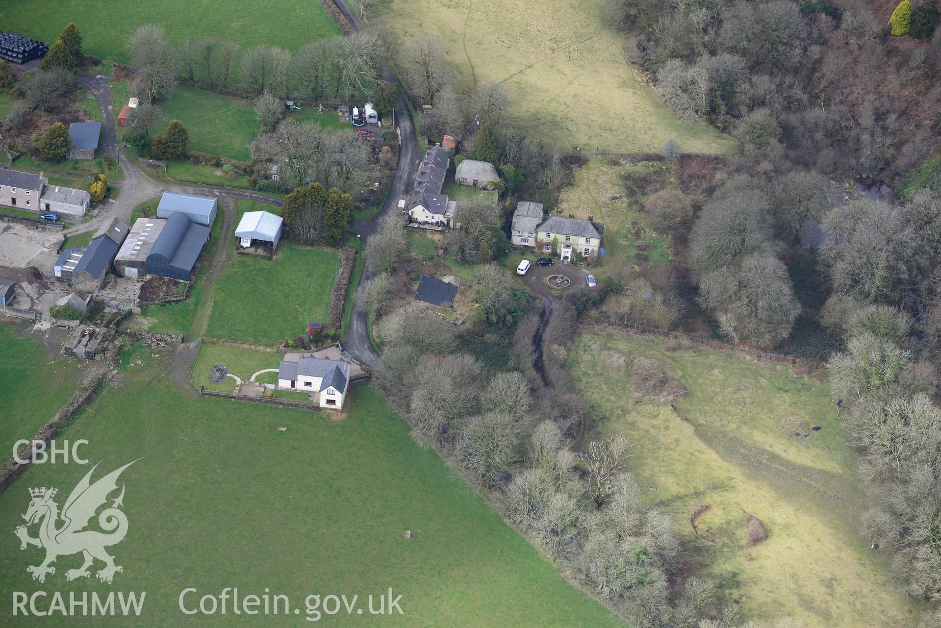 Prysg Farm and two standing stones in its southern fields; Temple Druid house and garden; outbuildings and 1-3 Temple Druid cottages, Maenclochog, Fishguard. Oblique aerial photograph taken during the Royal Commission's programme of archaeological aerial reconnaissance by Toby Driver on 13th March 2015.