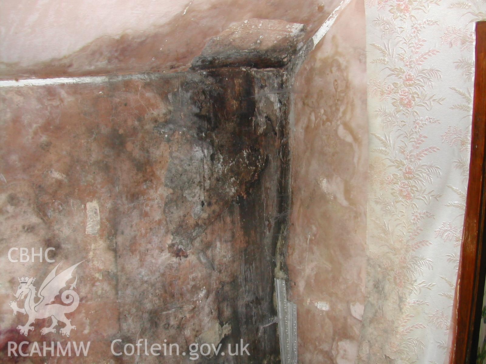 Colour photograph showing detailed interior view of damaged wall in Rosacre, Gronant, Prestatyn. Unknown date. Donated by the Conservation Department of Flintshire County Council, in advance of relocation to new offices.