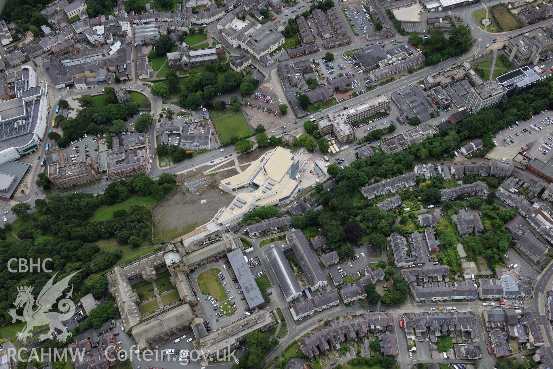 Bangor Cathedral, University, Theatr Gwynedd (demolished),Pontio, medieval church site, town hall and library. Oblique aerial photograph taken during the Royal Commission's programme of archaeological aerial reconnaissance by Toby Driver on 30th July 2015.