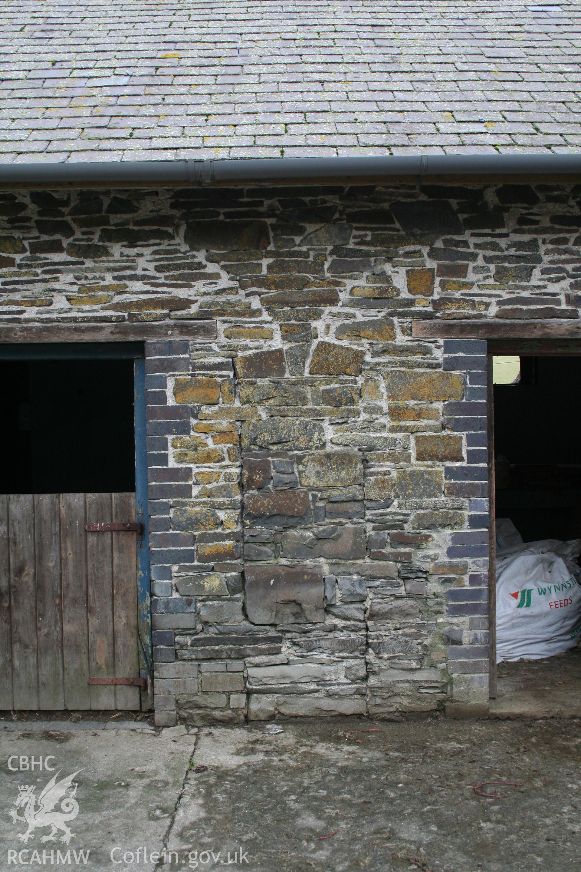 Exterior view of stable-esque door and engineering brick and stone doorway. Photographic survey of the southern range of cowhouses at Tan-y-Graig Farm, Llanfarian. Conducted by Geoff Ward and John Wiles, 11th December 2006.