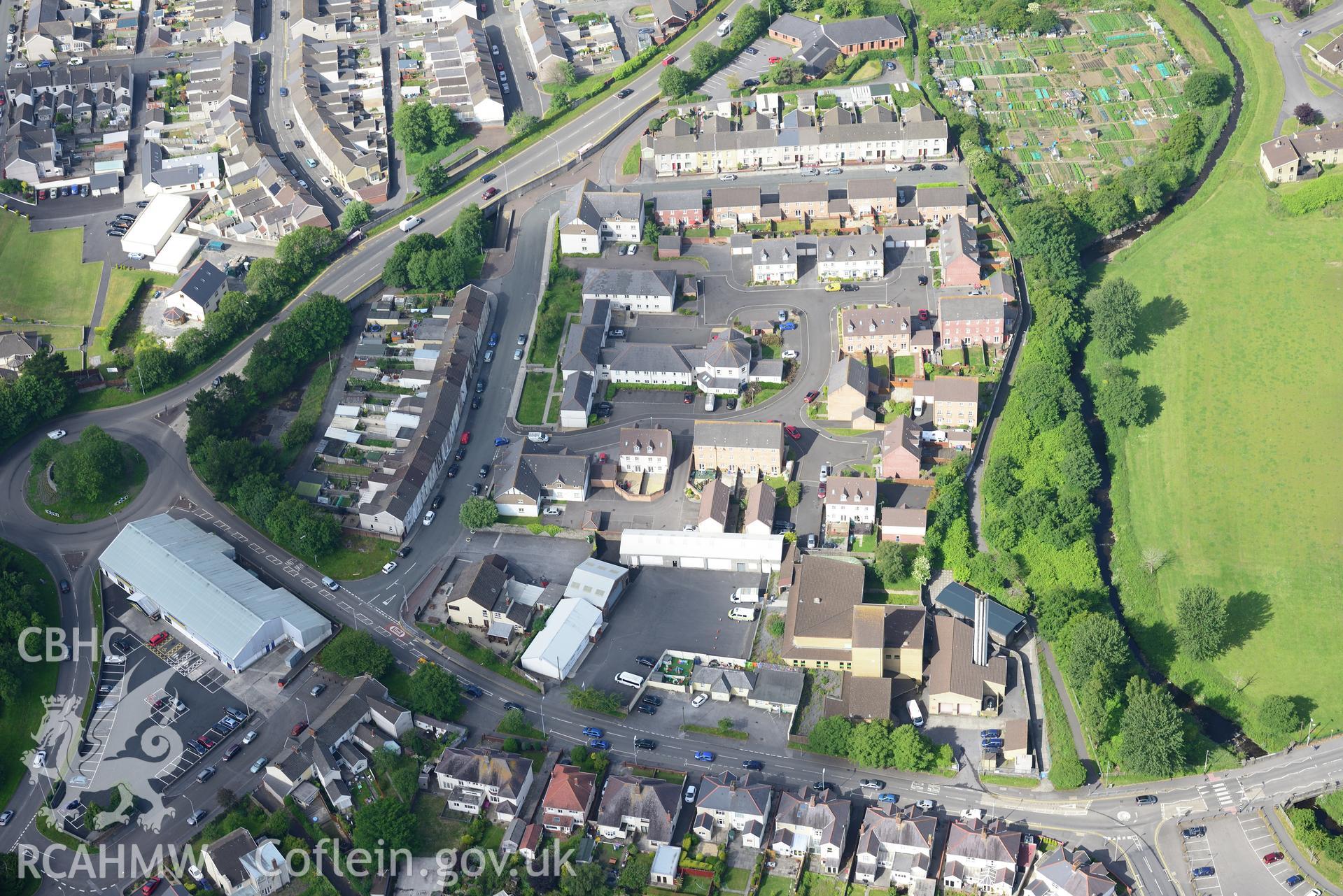 Salvation Army Church and housing on or near the site of the former Llanelli Slaughter house; Llanelli Union Workhouse and Talsarnau Colliery. Oblique aerial photograph taken during the Royal Commission's programme of archaeological aerial reconnaissance by Toby Driver on 19th June 2015.