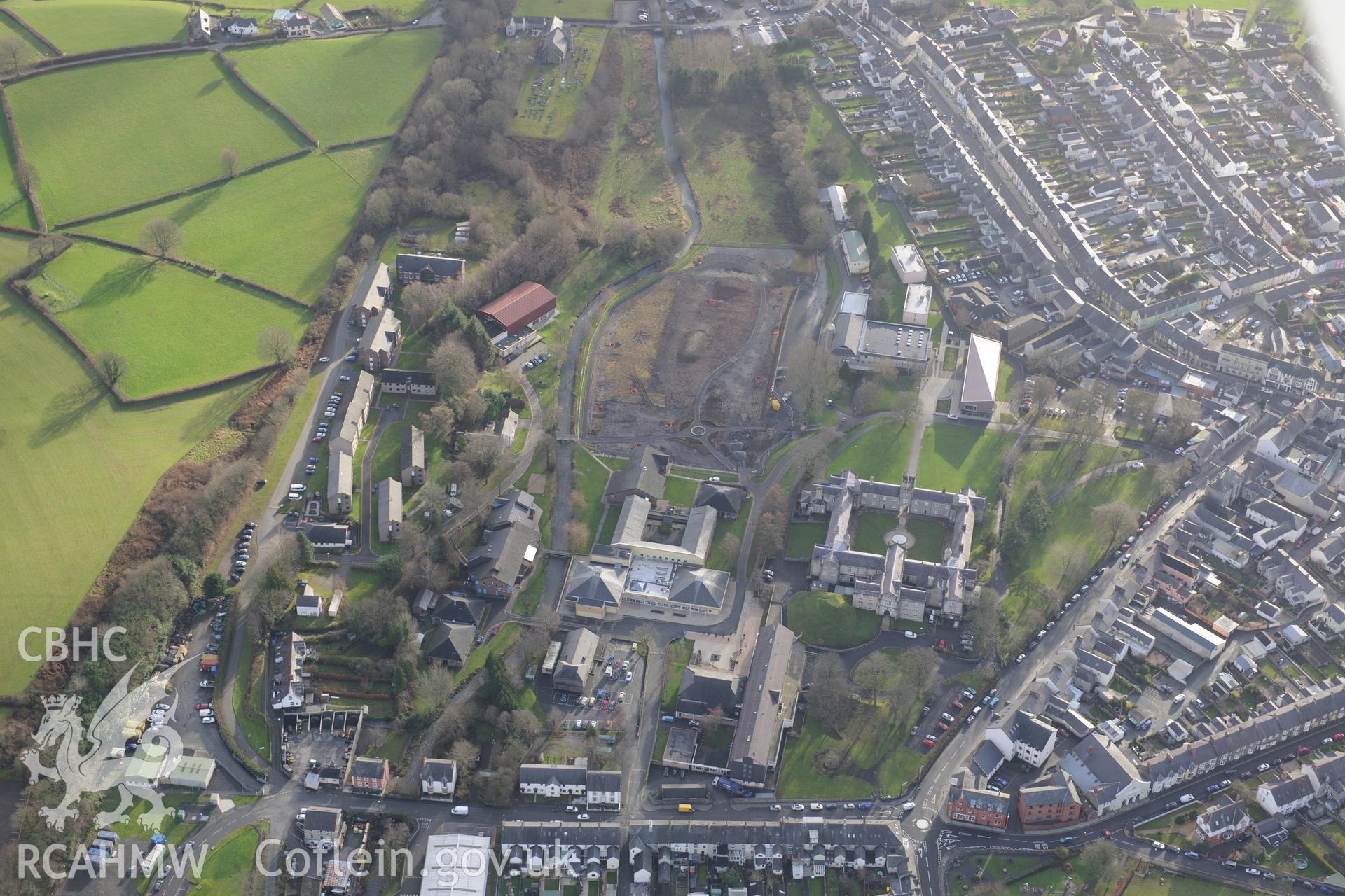 St David's College garden, the Roderic Bowen Library and Archives and Stephen's Castle, Lampeter. Oblique aerial photograph taken during the Royal Commission's programme of archaeological aerial reconnaissance by Toby Driver on 6th January 2015.
