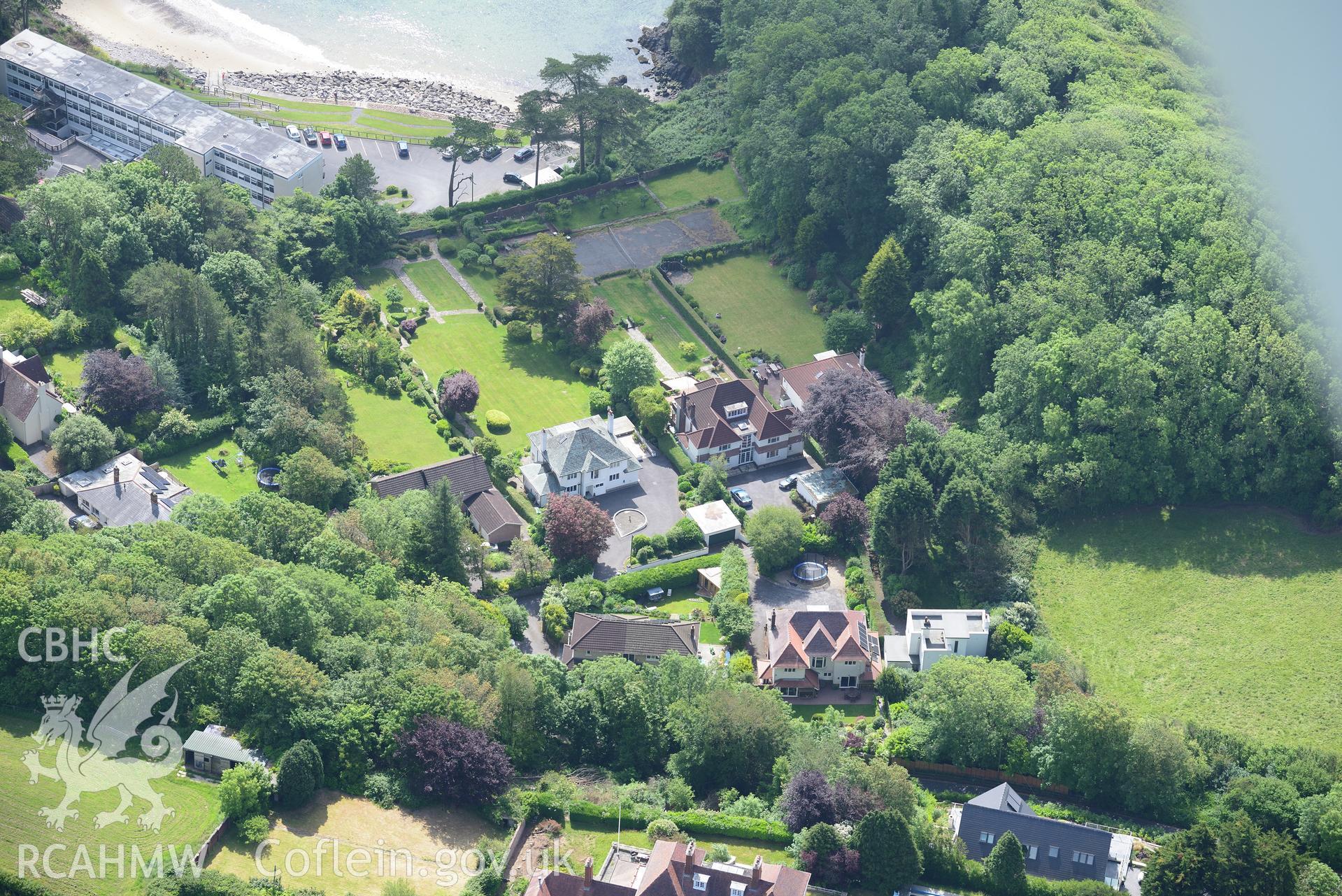 Housing at Caswell Bay. Oblique aerial photograph taken during the Royal Commission's programme of archaeological aerial reconnaissance by Toby Driver on 19th June 2015.