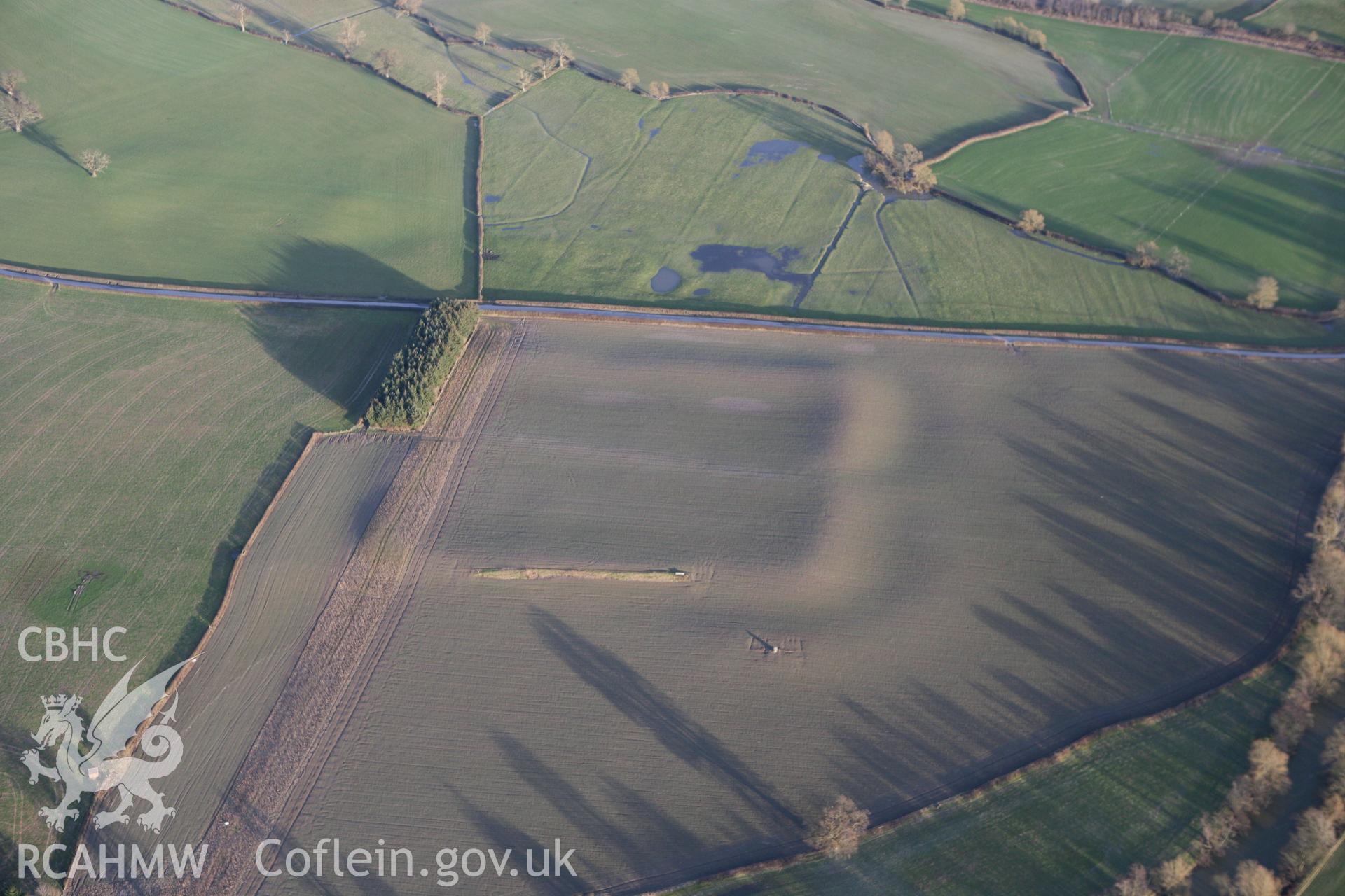 RCAHMW colour oblique photograph of Forden Gaer Roman Fort. Taken by Toby Driver on 08/02/2011.