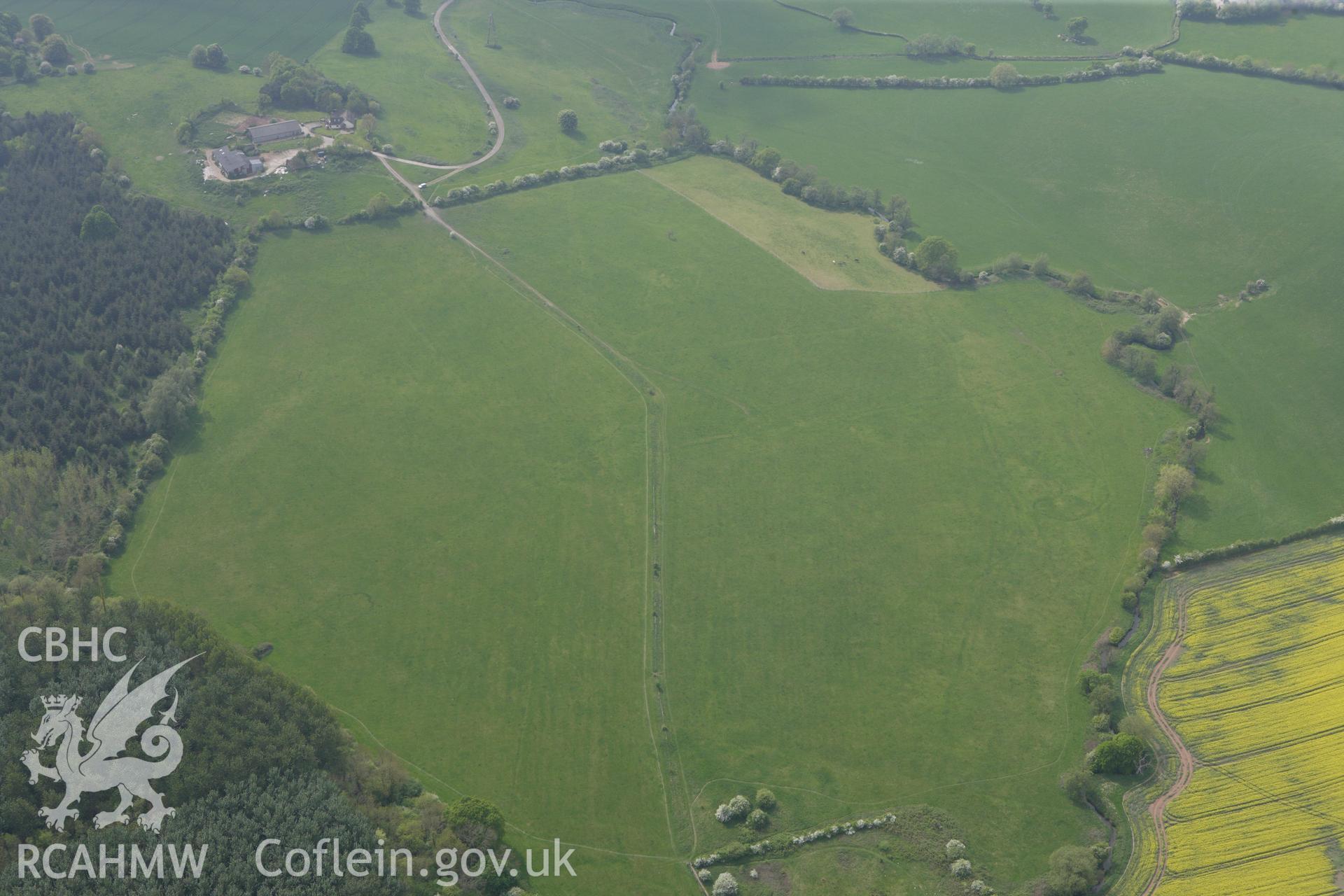 RCAHMW colour oblique photograph of Monks Ditch, landscape from east. Taken by Toby Driver on 26/04/2011.
