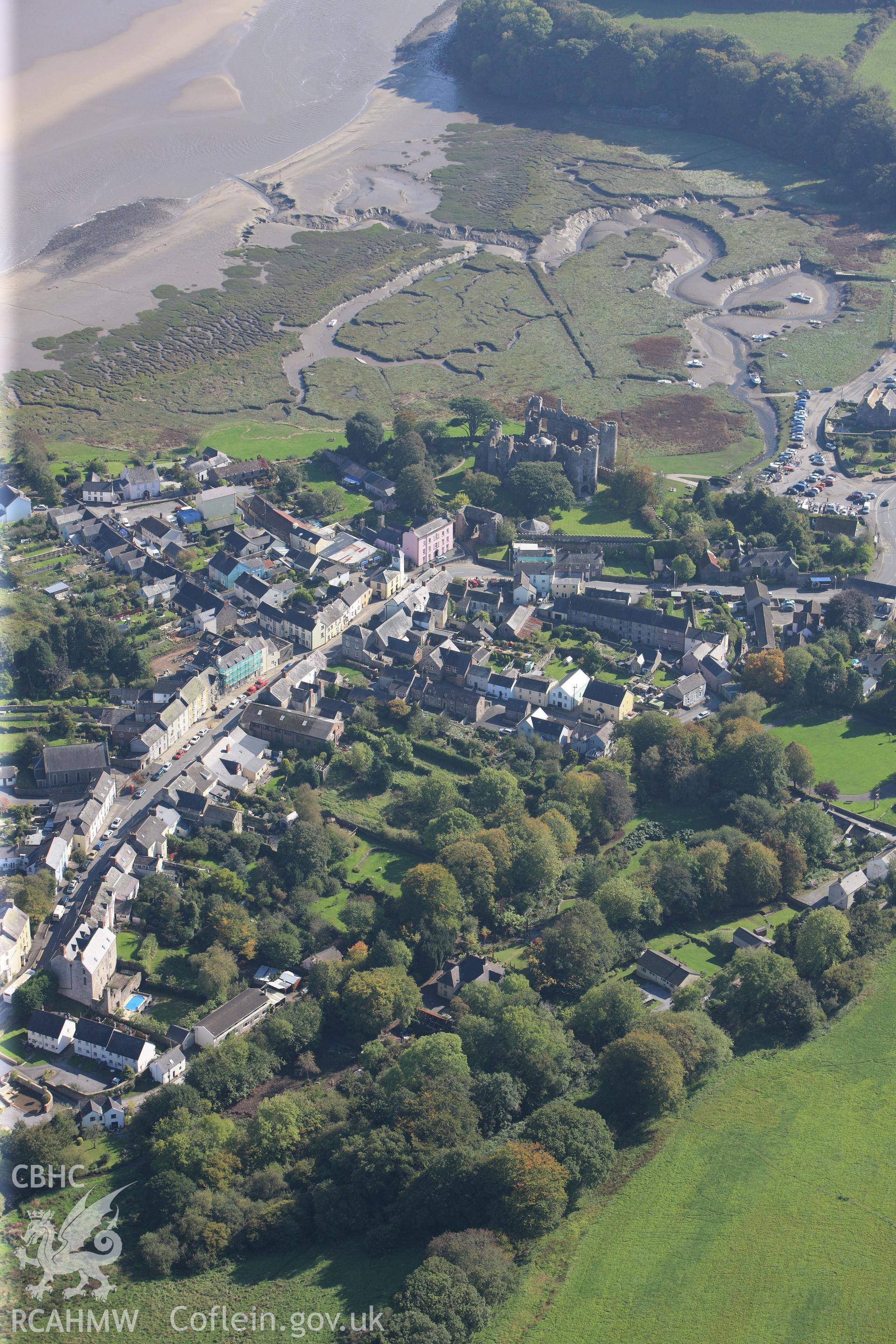 RCAHMW colour oblique photograph of Laugharne, viewed from the north-west, looking seaward towards the castle. Taken by Toby Driver and Oliver Davies on 28/09/2011.