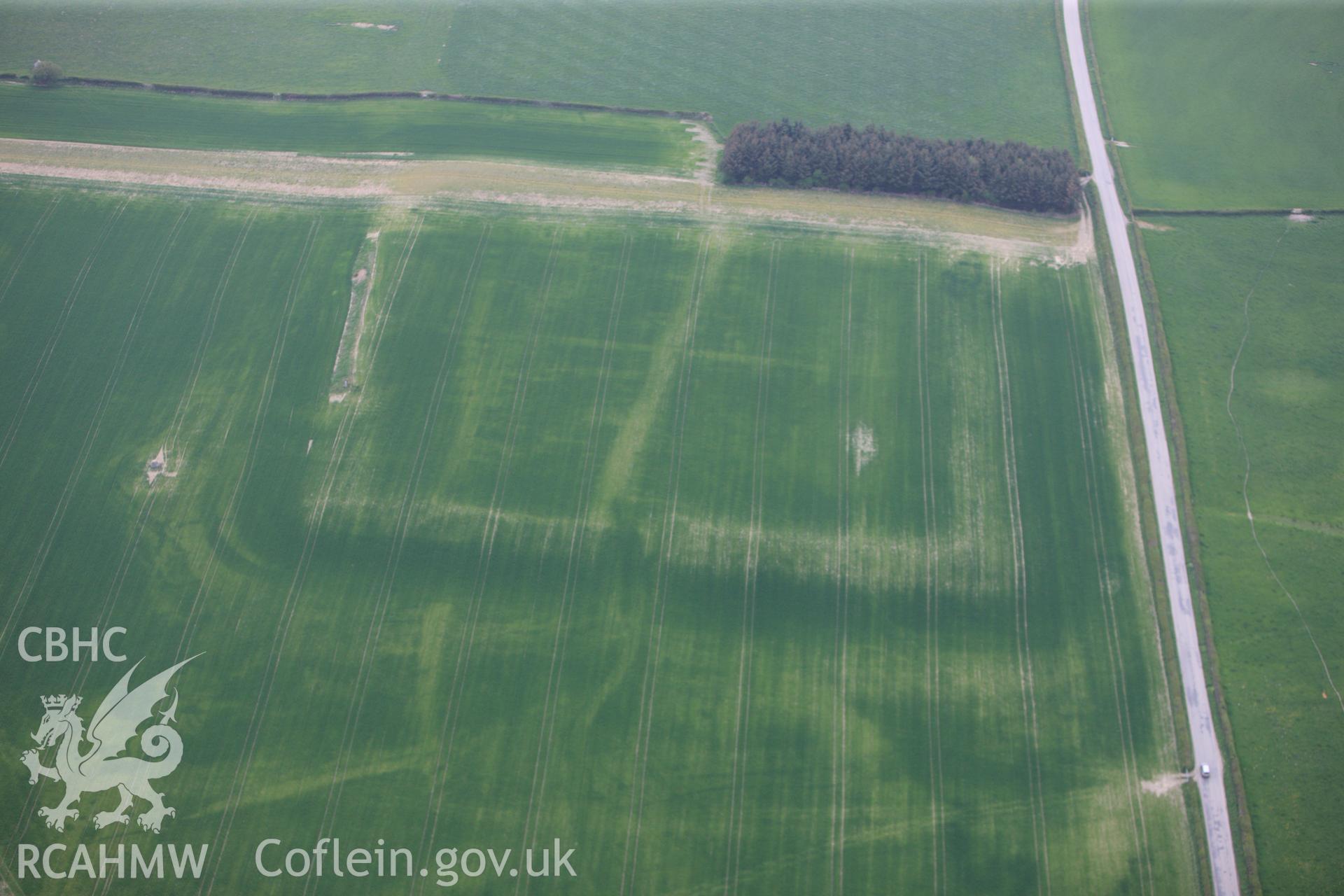 RCAHMW colour oblique photograph of Forden Gaer Roman settlement, with cropmarks showing. Taken by Toby Driver on 26/04/2011.