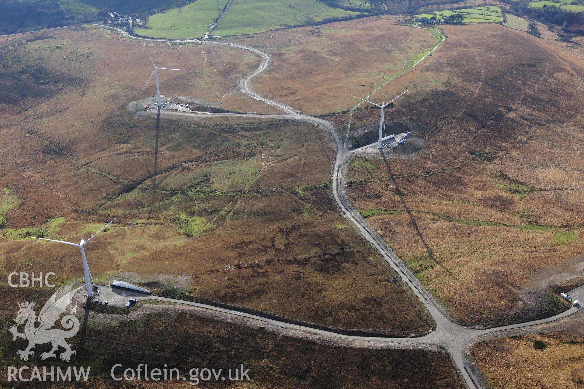 RCAHMW colour oblique photograph of Mynydd y Betws windfarm. Taken by Toby Driver on 28/11/2012.