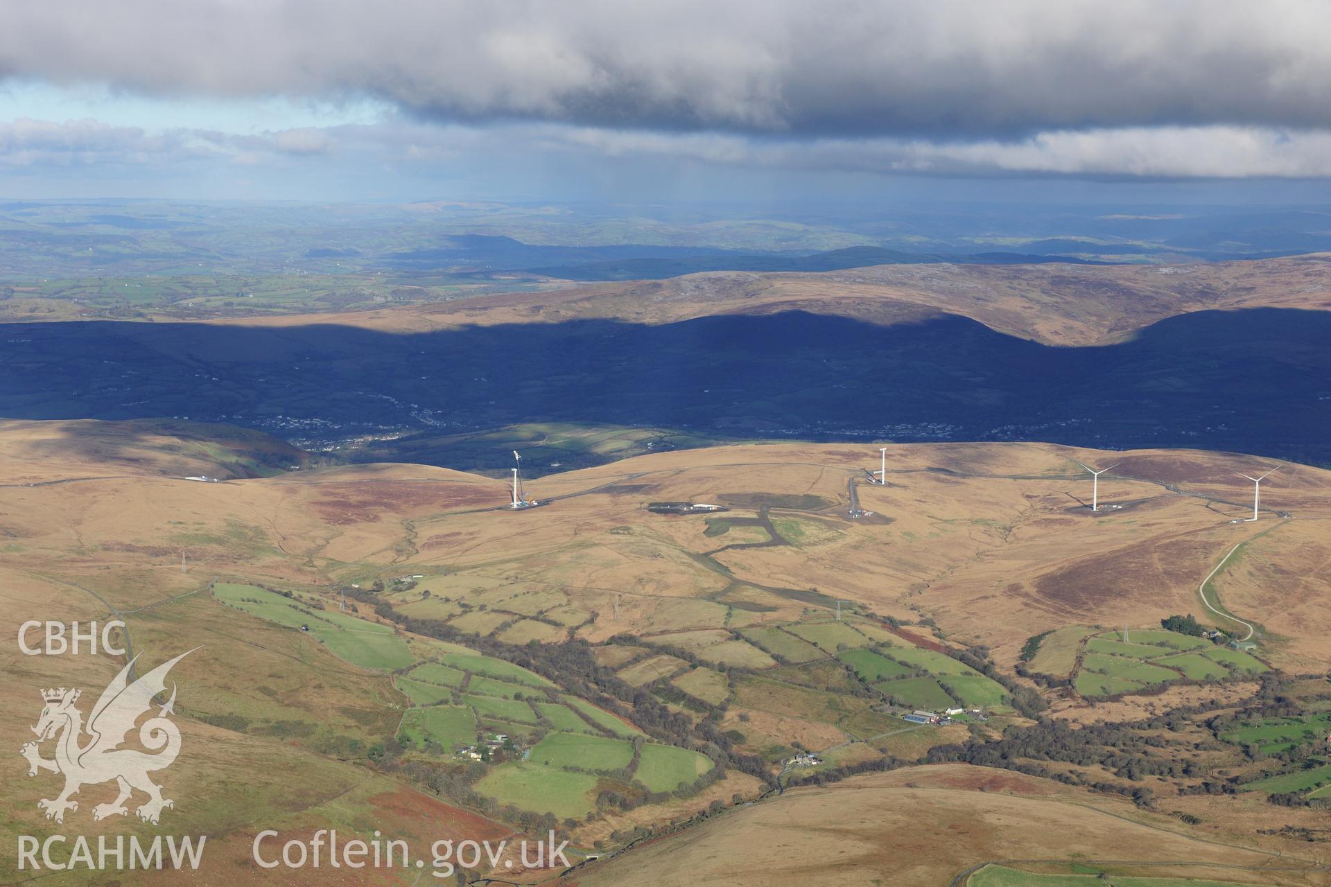 RCAHMW colour oblique photograph of Mynydd y Betws windfarm, distant view from south. Taken by Toby Driver on 28/11/2012.