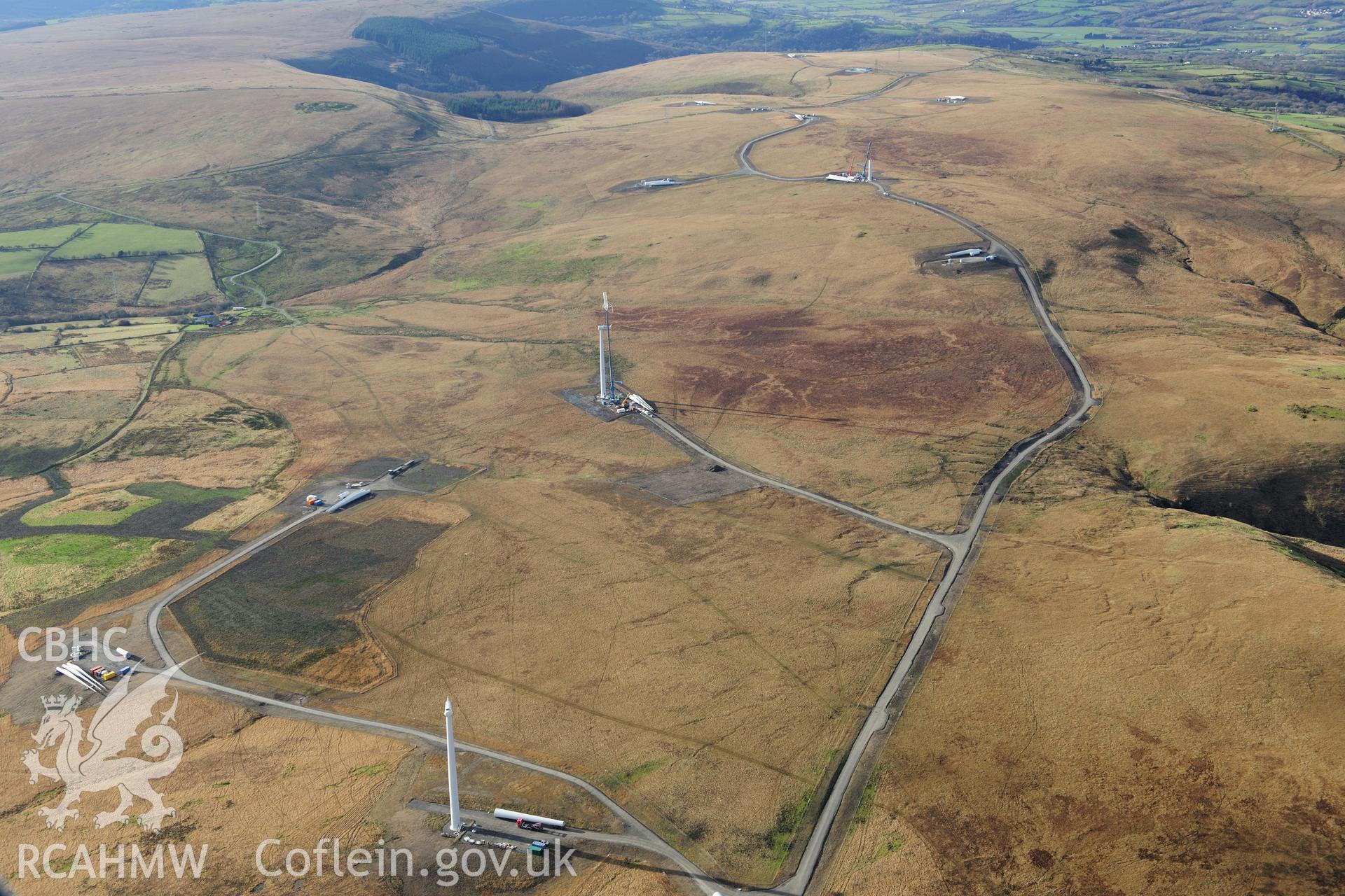 RCAHMW colour oblique photograph of Mynydd y Betws windfarm, from north-east. Taken by Toby Driver on 28/11/2012.
