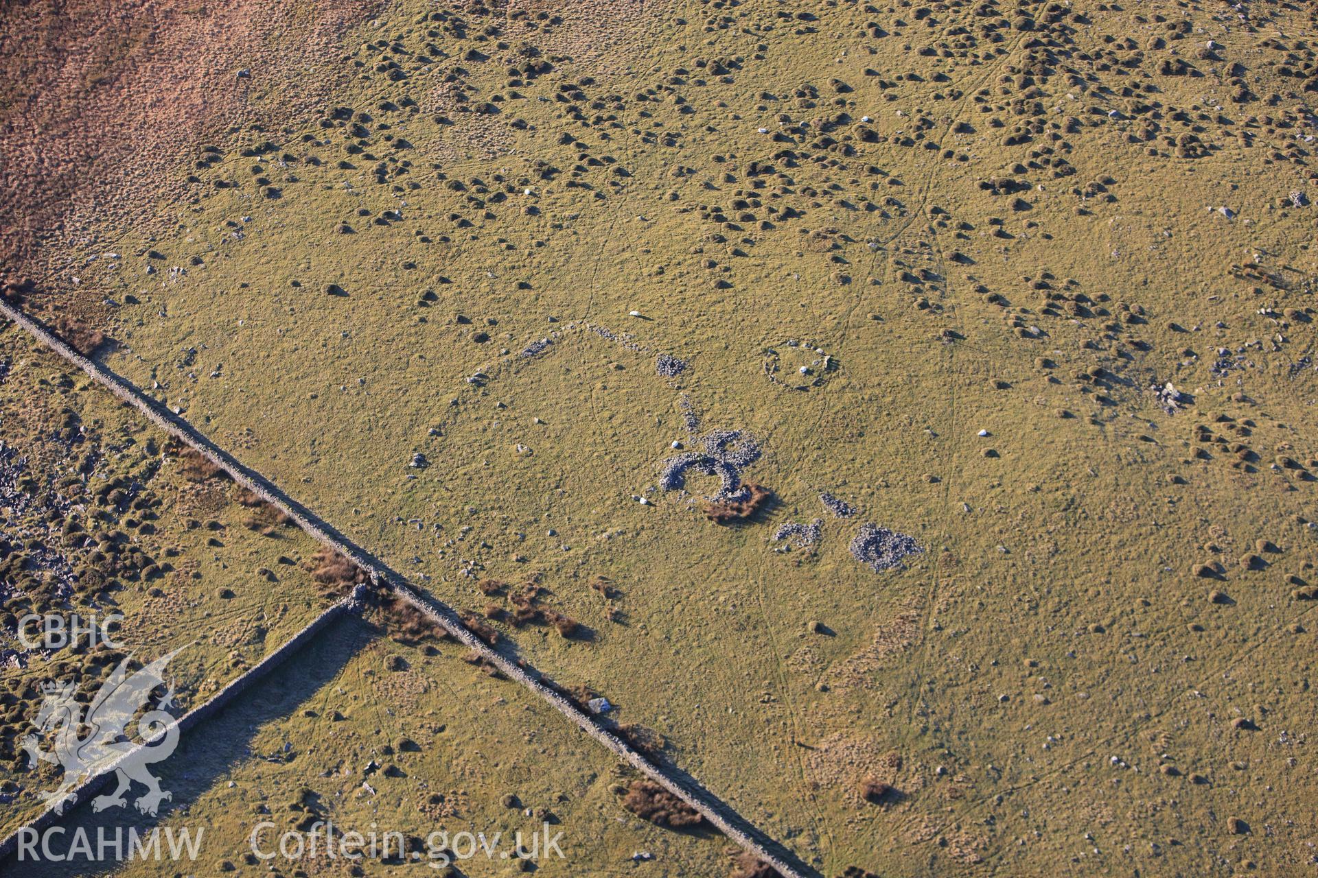 RCAHMW colour oblique photograph of Mynydd Egryn, hut circle settlement. Taken by Toby Driver on 10/12/2012.
