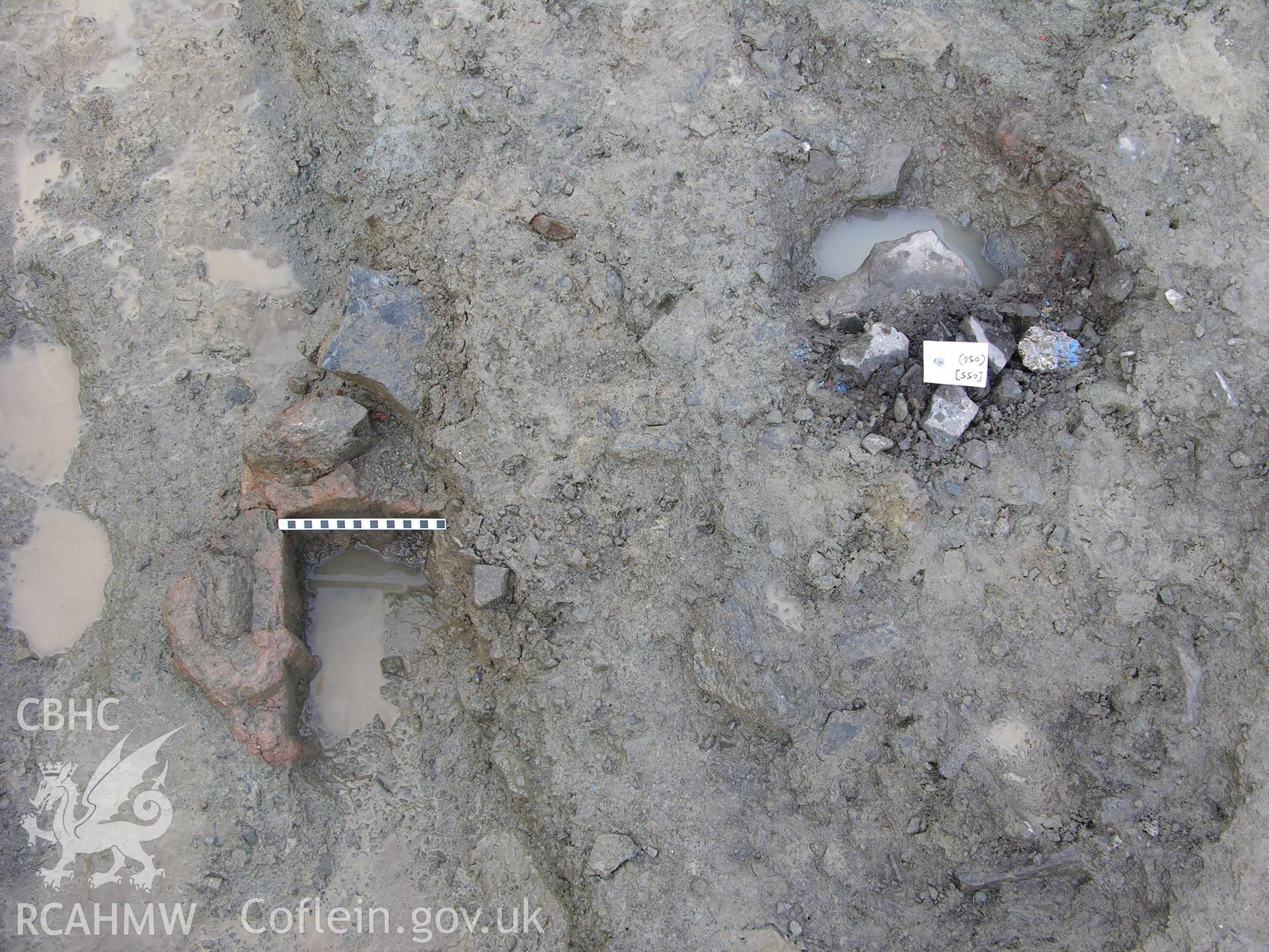 Colour digital photograph showing view of posthole with cement/plaster setting (left) - part of the Archaeological Excavation report for Horse Yard Farm, Evenjobb (CAP Report 607) by Chris E Smith, from a Cambrian Archaeological Projects assessment survey.
