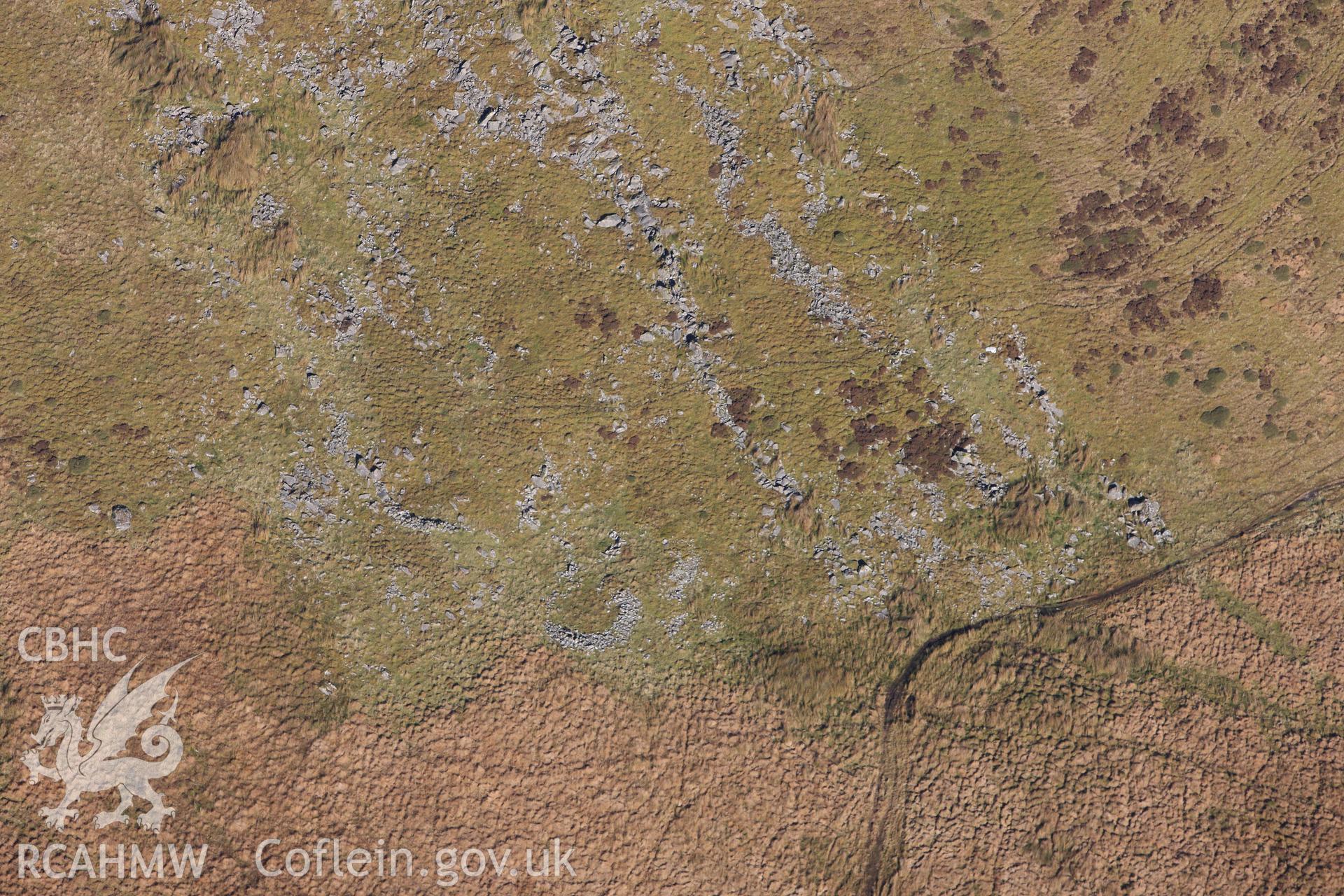 RCAHMW colour oblique photograph of Hut circle settlement below Foel Isaf. Taken by Toby Driver on 05/11/2012.