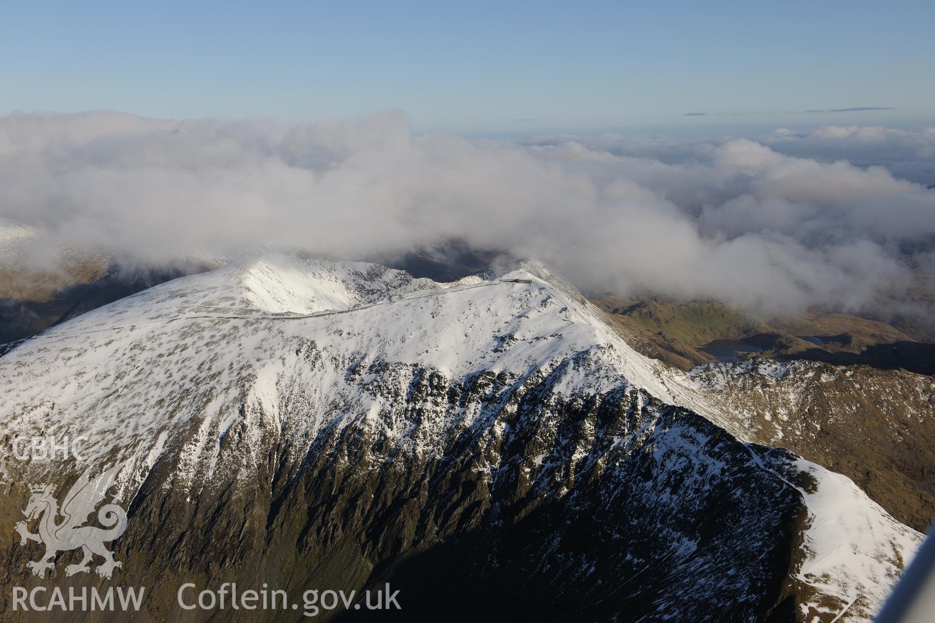 RCAHMW colour oblique photograph of Snowdon summit under snow, view from the west. Taken by Toby Driver on 10/12/2012.