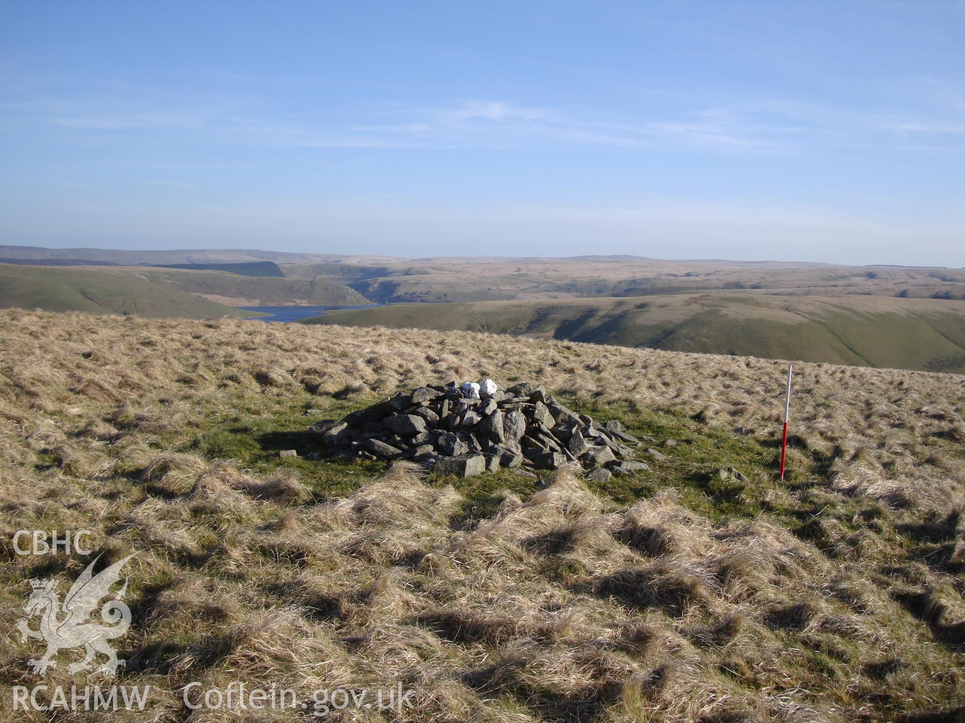 Marker cairn, overlying grass-covered Bronze Age cairn, NPRN 502565, looking south.