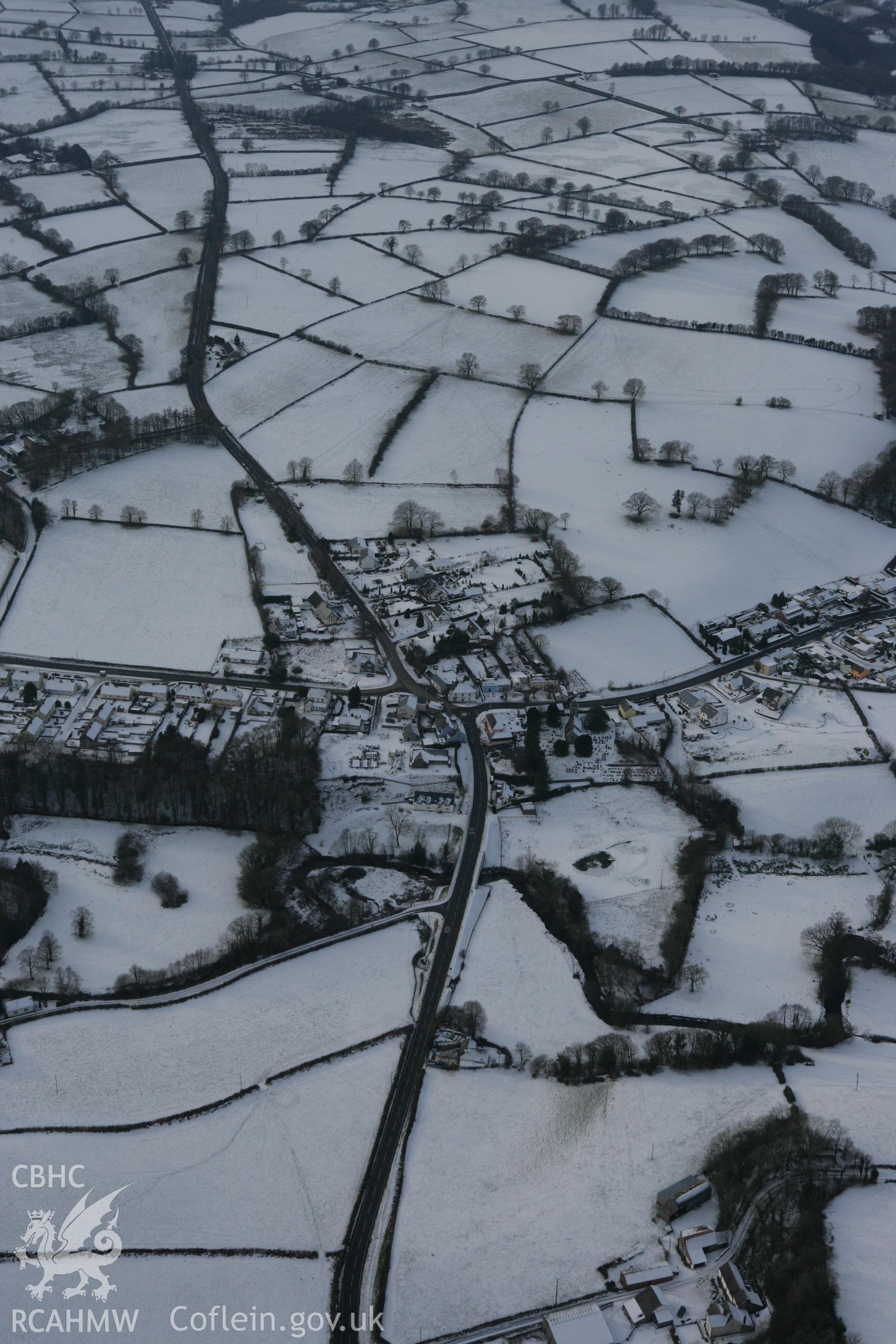 RCAHMW colour oblique photograph of Llanwnnen village. Taken by Toby Driver on 02/12/2010.
