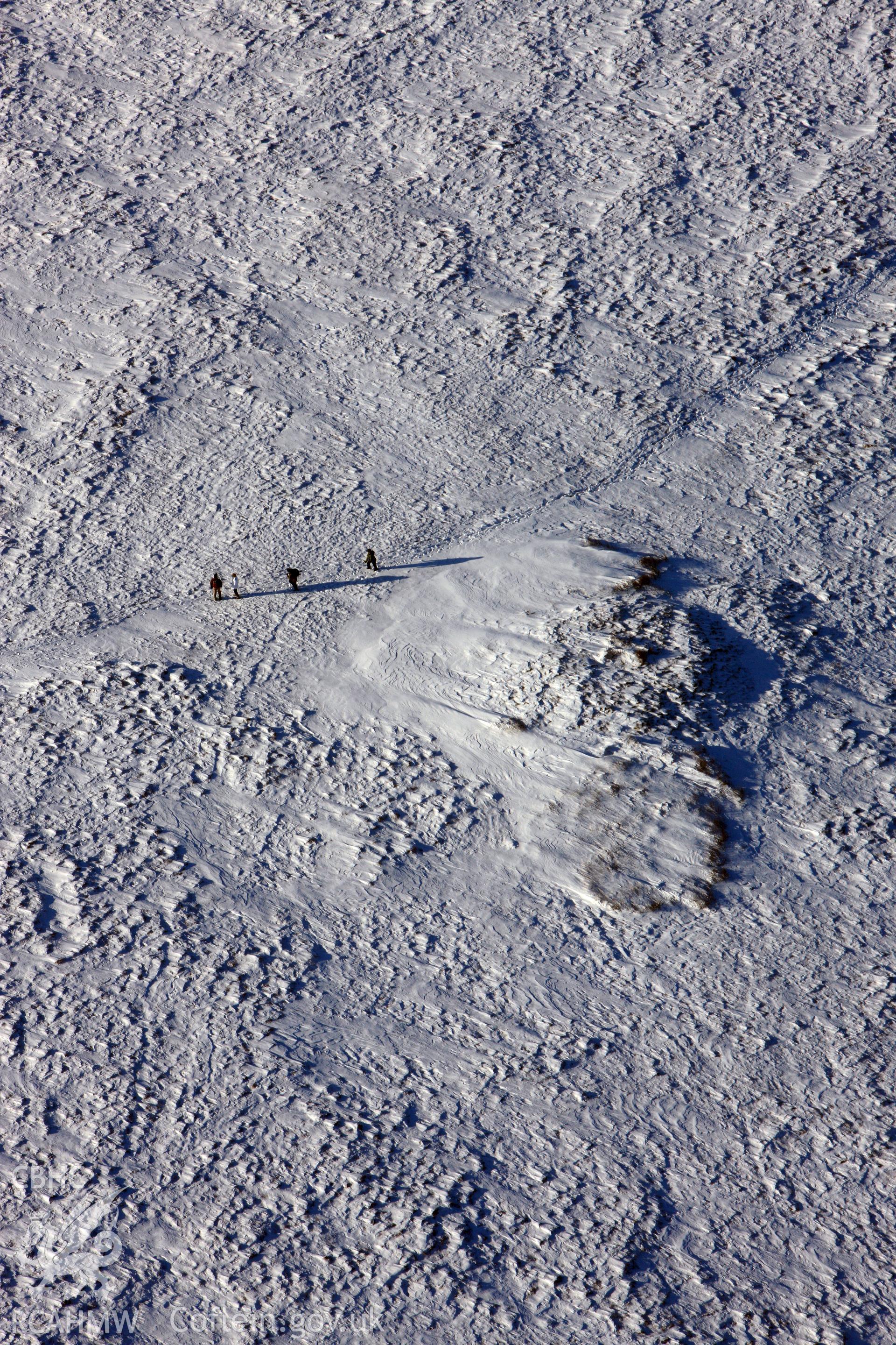 RCAHMW colour oblique aerial photograph of Foel Cwmcerwyn cairn under snow, by Toby Driver, 01/12/2010.