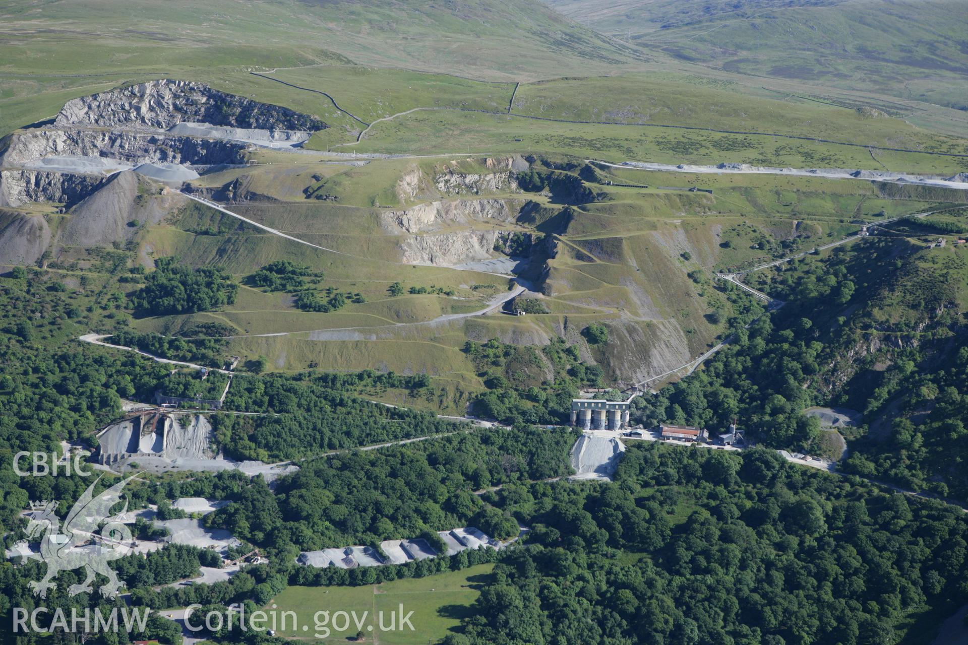 RCAHMW colour oblique photograph of Penmaenmawr Stone Quarry. Taken by Toby Driver on 16/06/2010.