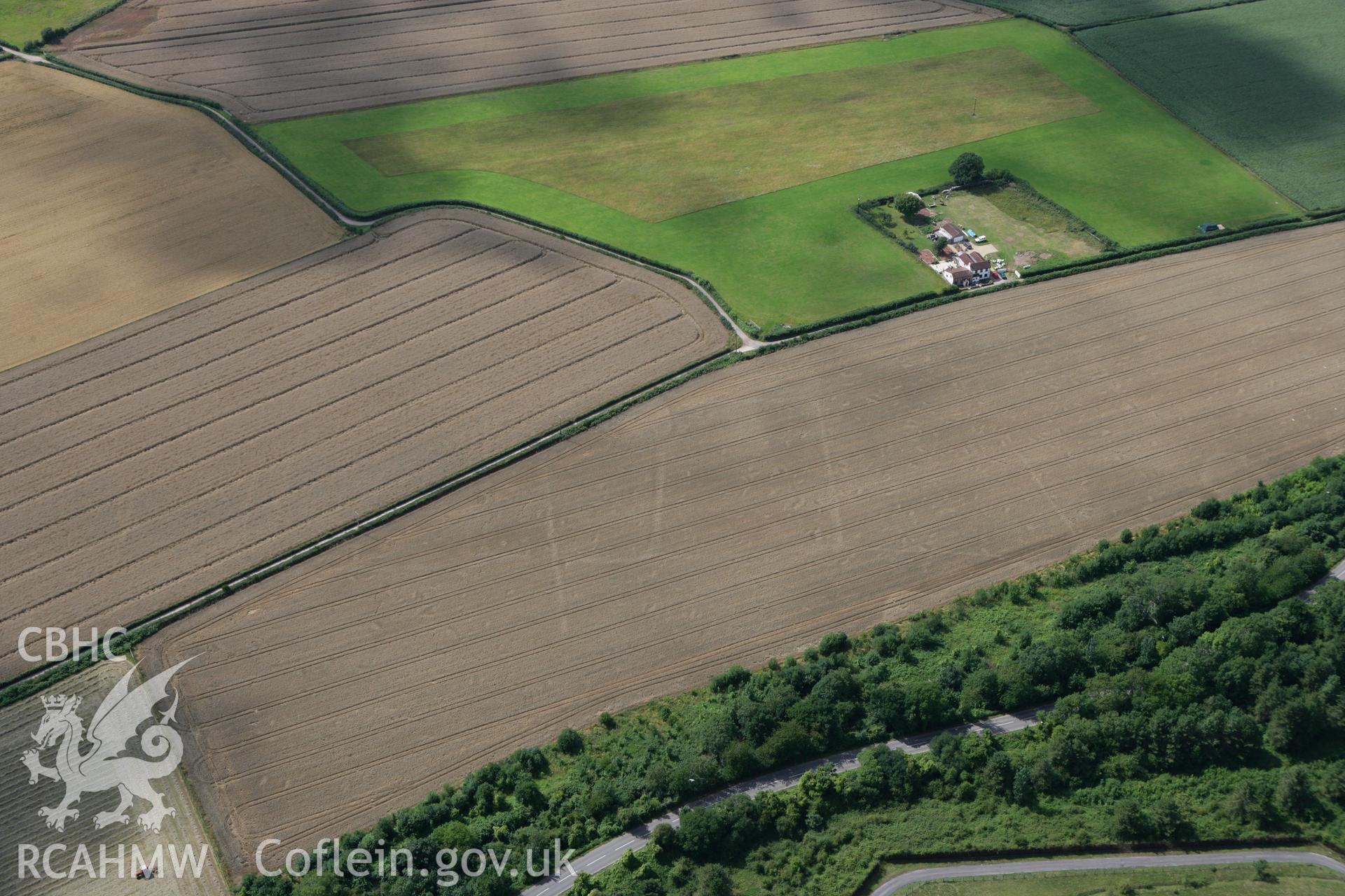 RCAHMW colour oblique photograph of Trewern Enclosure Complex, Ancient Field System. Taken by Toby Driver on 29/07/2010.