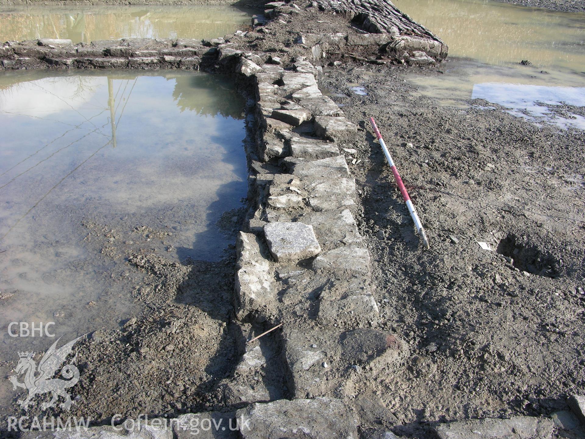 Colour digital photograph showing view of less well faced masonry on southern end of post medieval structure - part of the Archaeological Excavation report for Horse Yard Farm, Evenjobb (CAP Report 607) by Chris E Smith, from a Cambrian Archaeological Projects assessment survey.