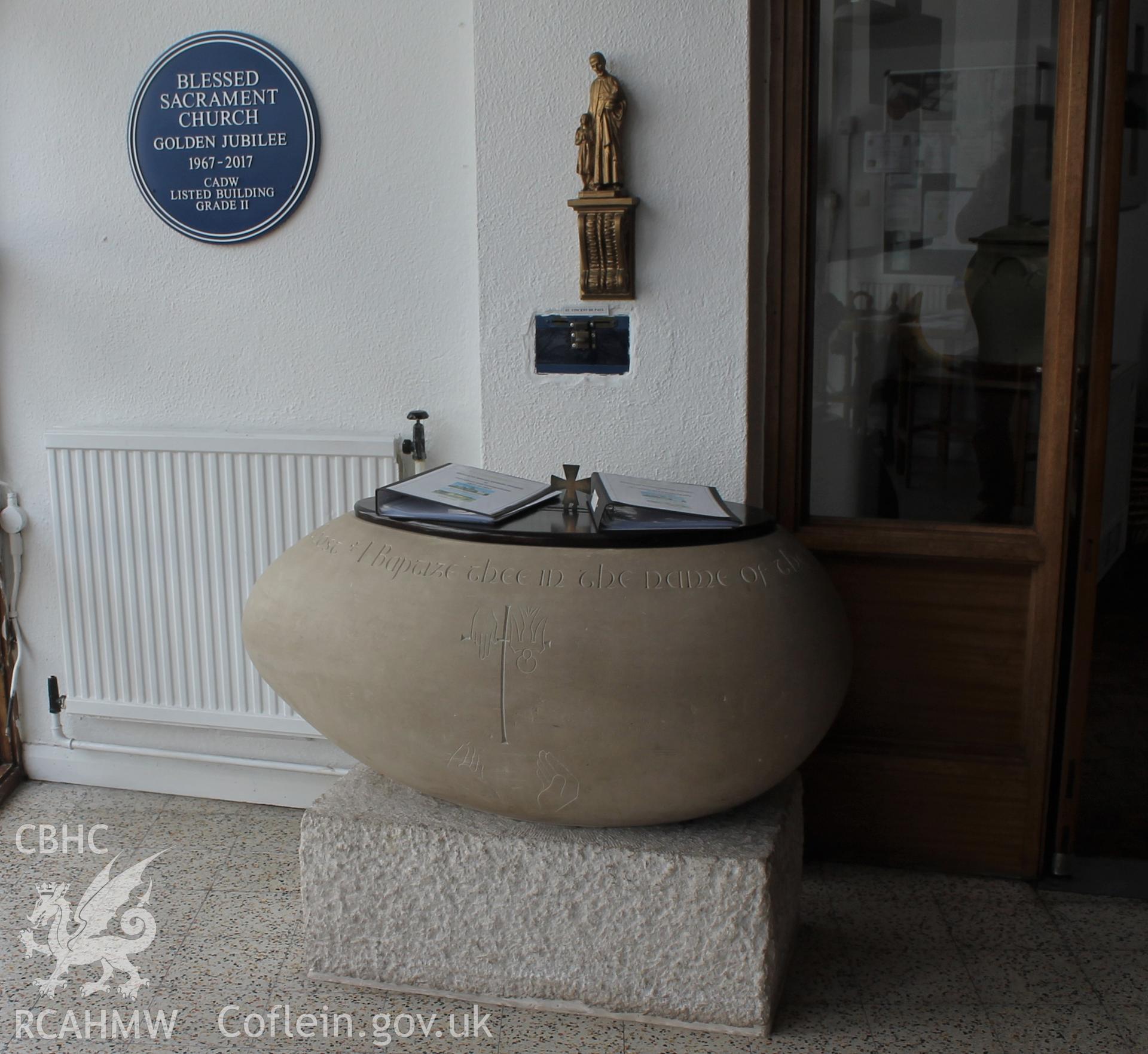 Digital colour photograph showing the ovoid stone font at Blessed Sacrament Catholic church, Gorseinon.