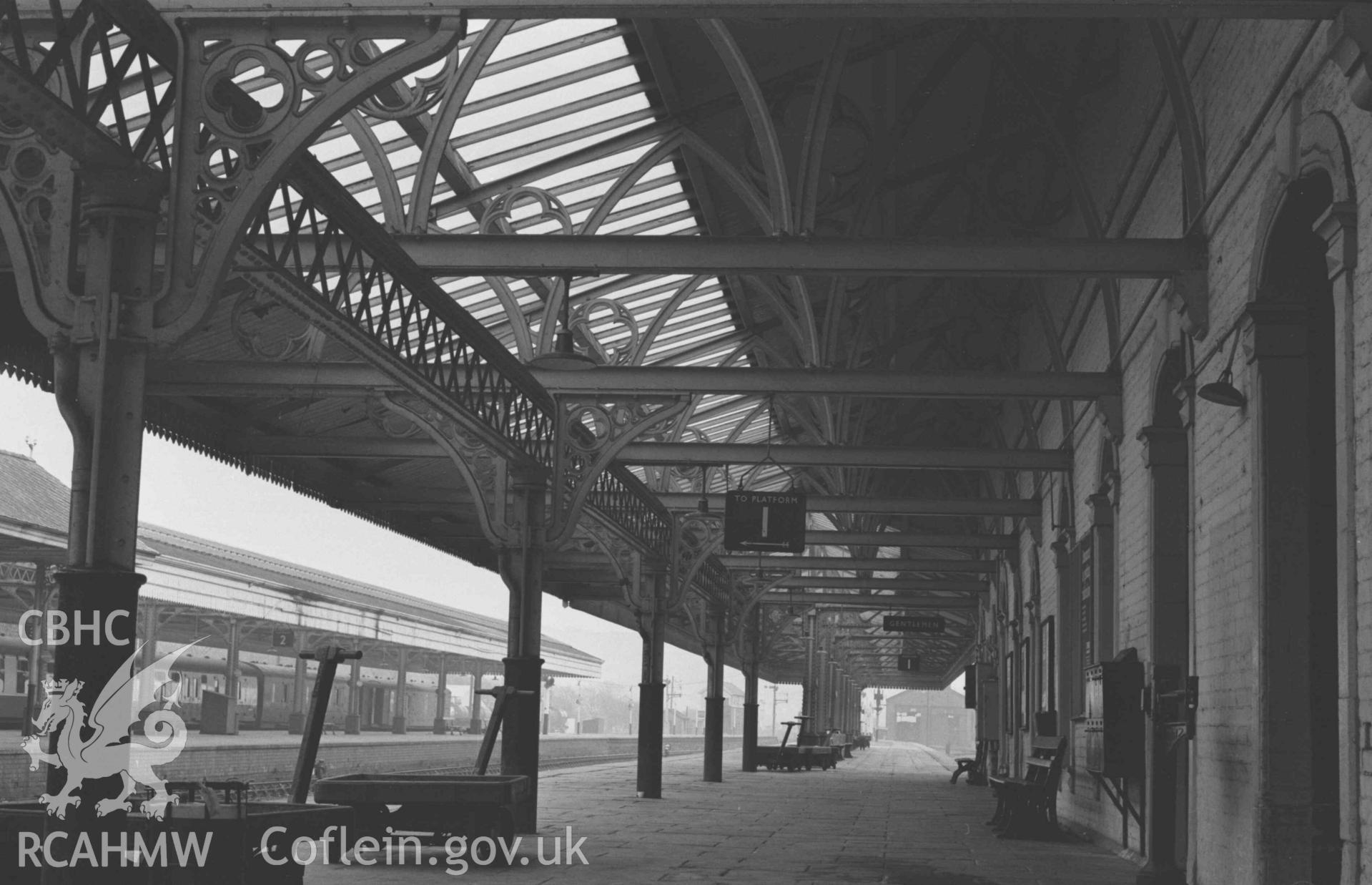 Digital copy of a black and white negative showing iron roof gurders above Platform 1 at Abersytwyth Railway Station. Photographed by Arthur Chater on 3 January 1969. Looking south east from Grid Reference SN 5852 8157.