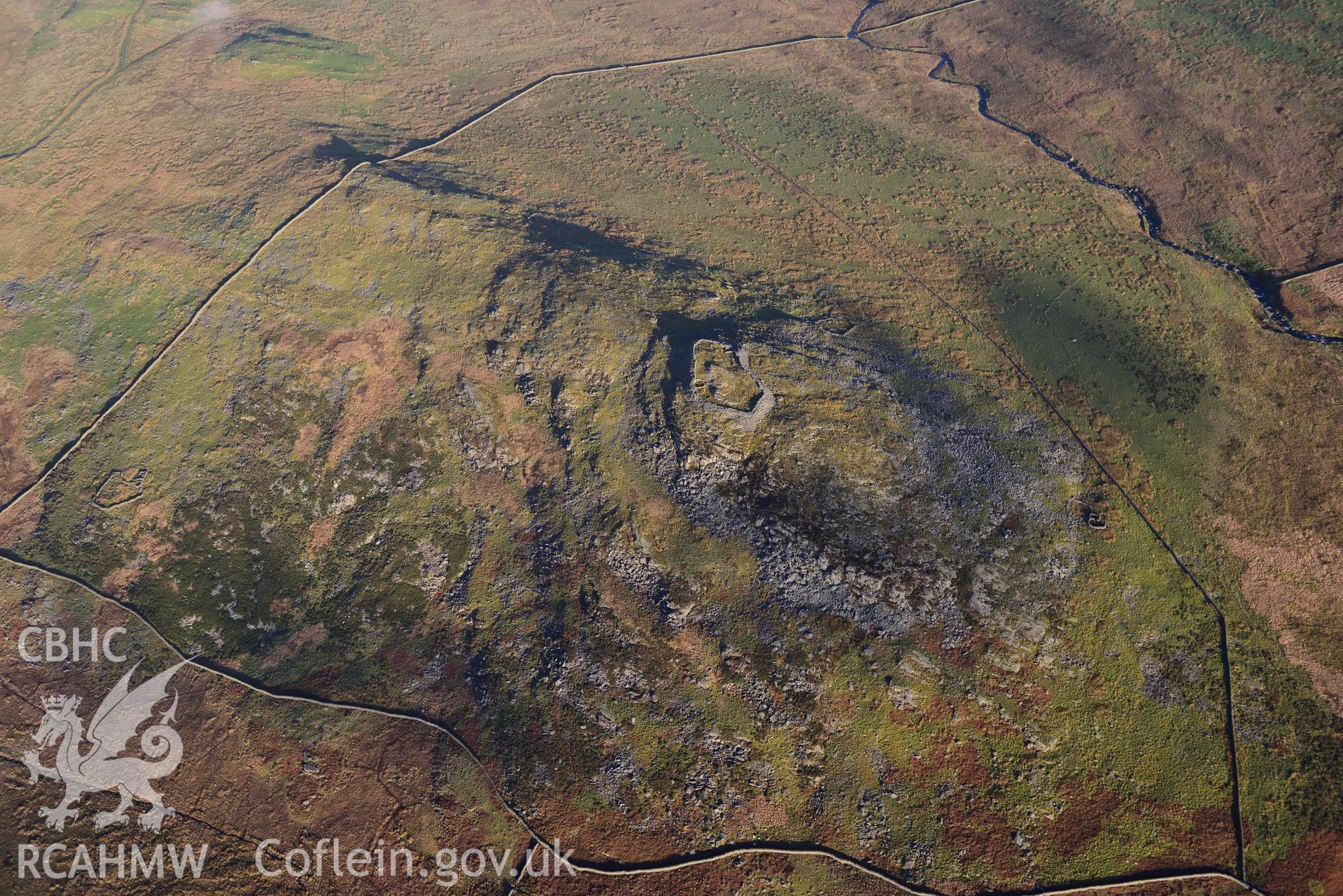 Oblique aerial photograph of Craig y Dinas hillfort and landscape, taken during the Royal Commission