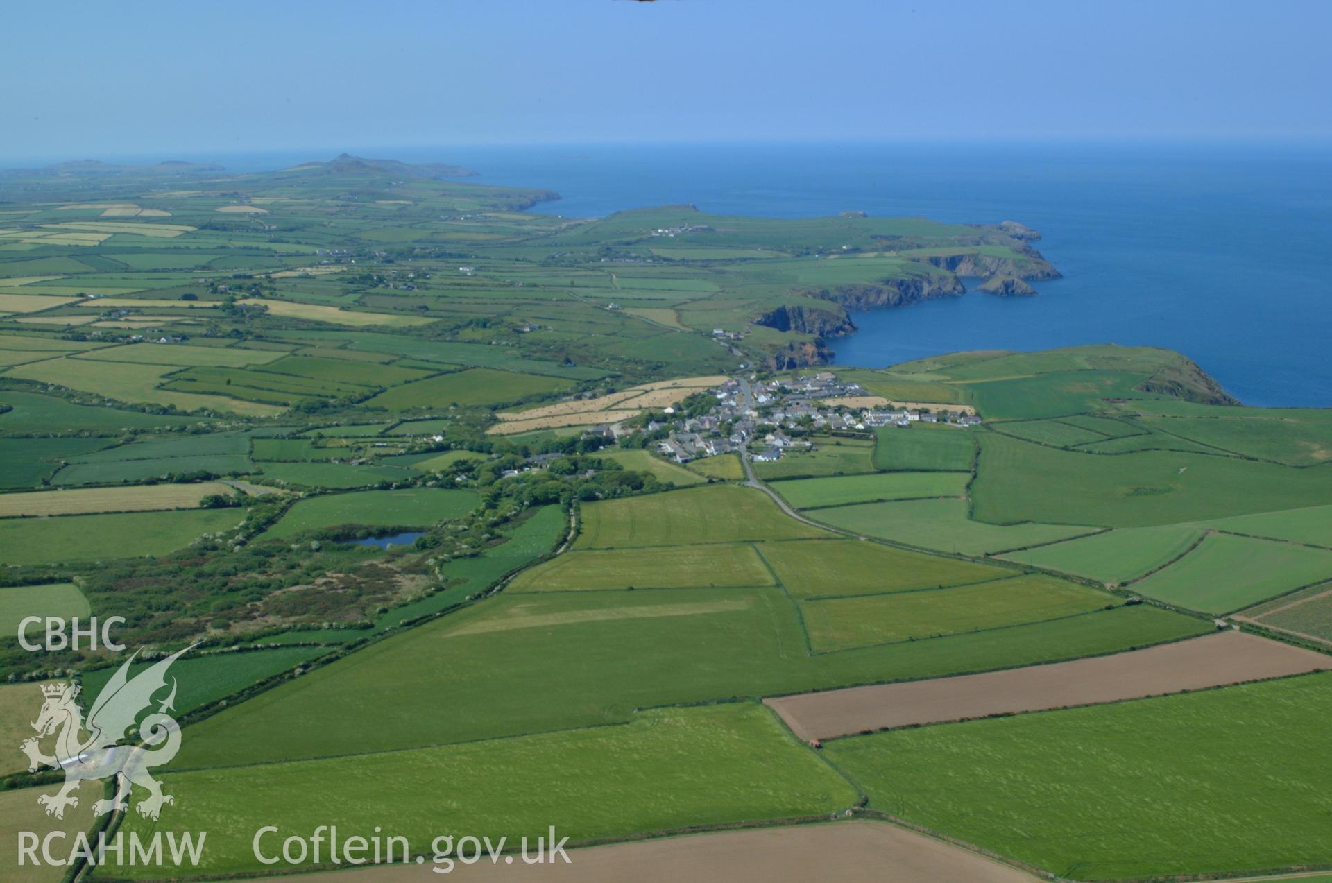 RCAHMW colour oblique aerial photograph of Trefin Chapel (Welsh Calvinistic Methodist) and Trefin Village in landscape view from the east. Taken on 25 May 2004 by Toby Driver