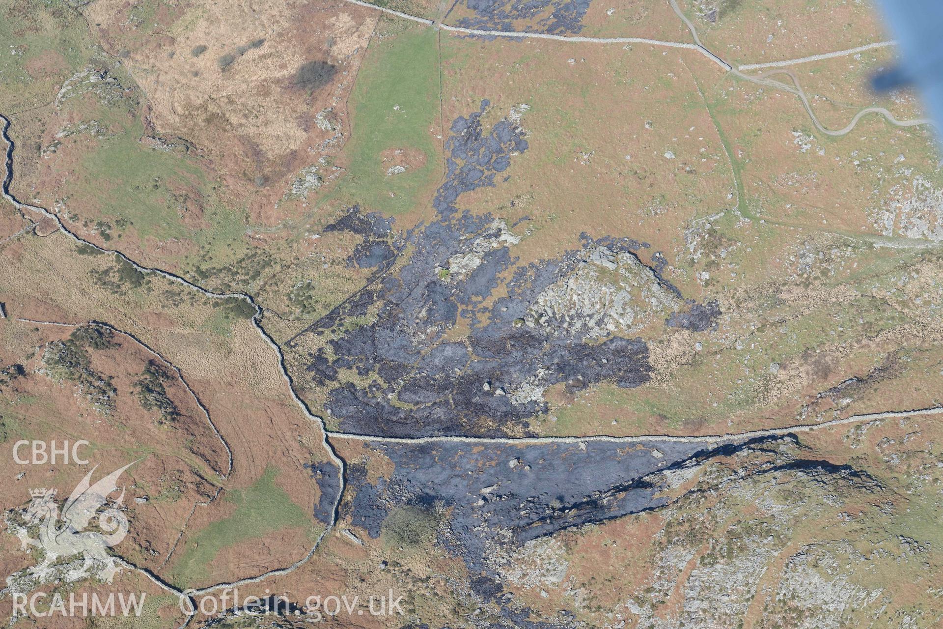 Gydwaen, recent bracken burn. Oblique aerial photograph taken during the Royal Commission’s programme of archaeological aerial reconnaissance by Toby Driver on 25 March 2022.