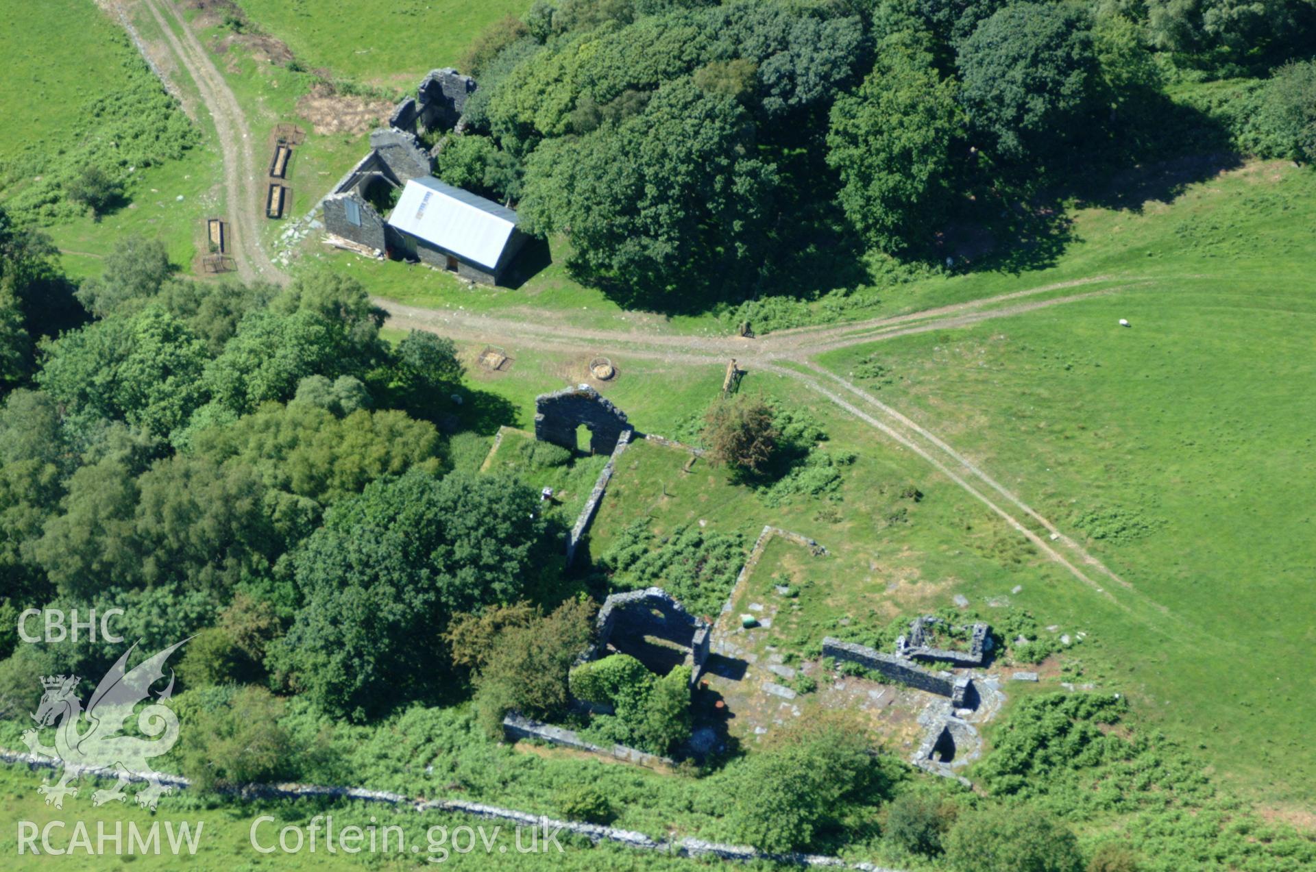 RCAHMW colour oblique aerial photograph of the mine office at Bryndyfi Lead Mine taken on 14/06/2004 by Toby Driver
