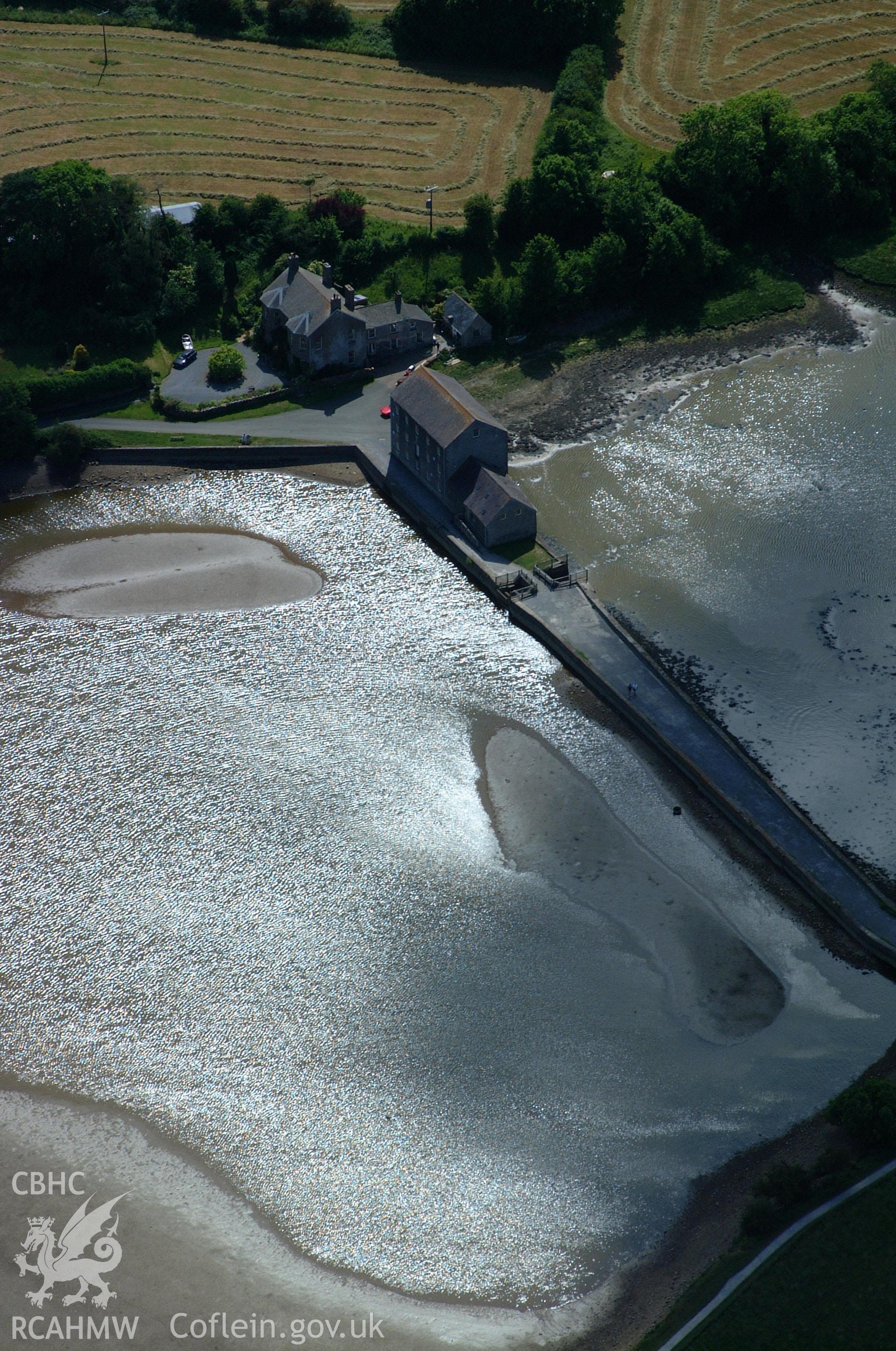 RCAHMW colour oblique aerial photograph of Carew Tide Mill taken on 15/06/2004 by Toby Driver