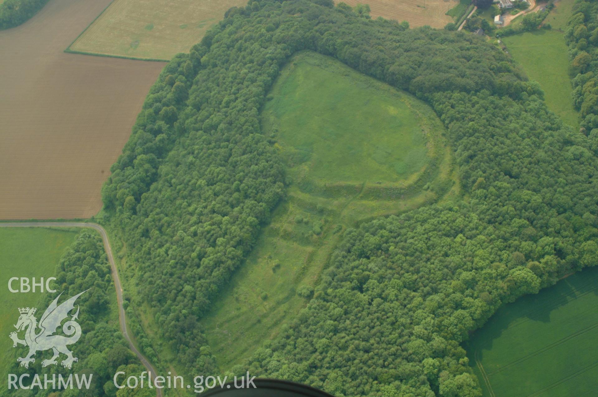 RCAHMW colour oblique aerial photograph of Llanmelin Wood Hillfort taken on 26/05/2004 by Toby Driver