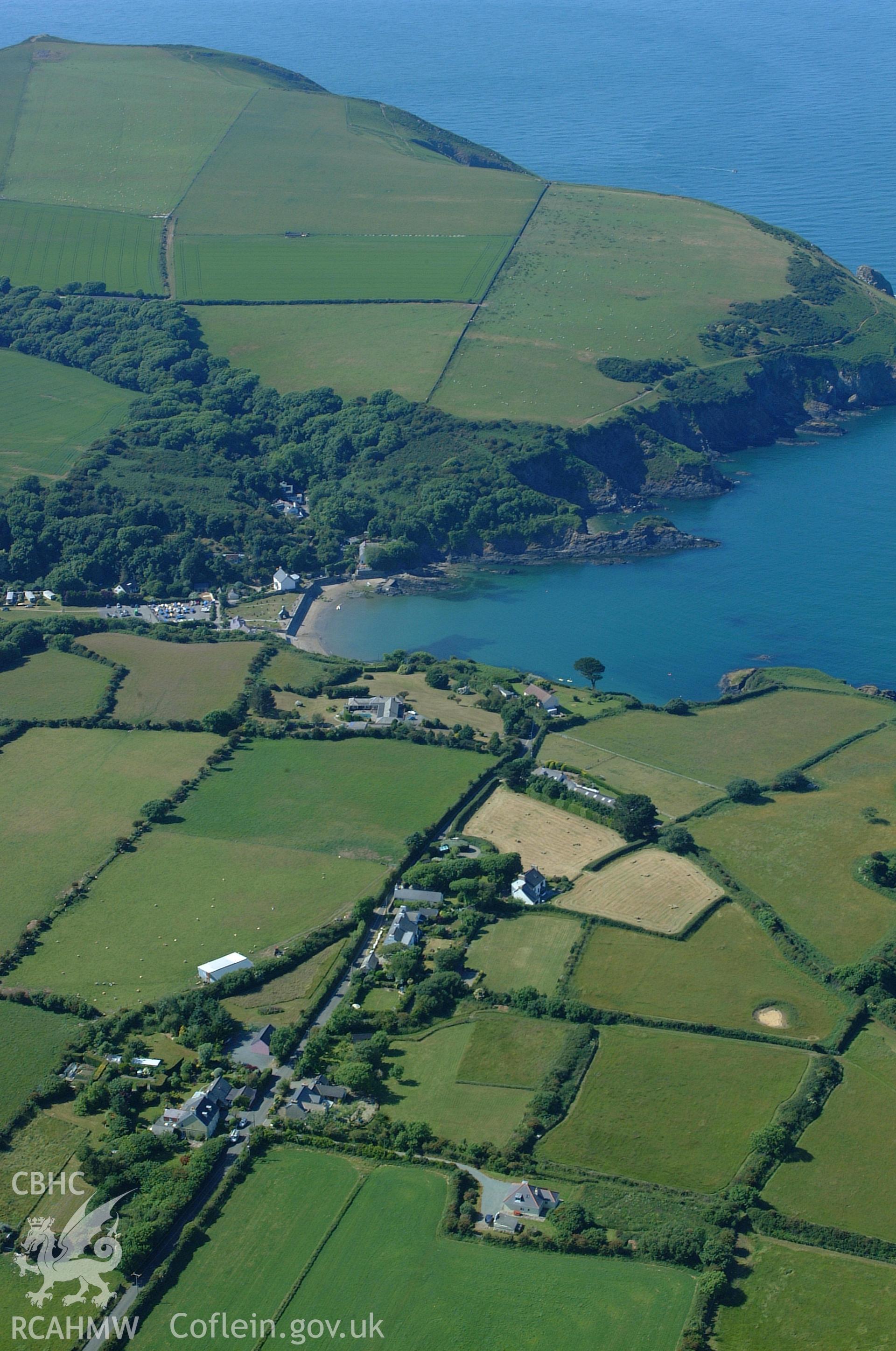 RCAHMW colour oblique aerial photograph of Dinas harbour and Cwm-yr-eglwys taken on 15/06/2004 by Toby Driver
