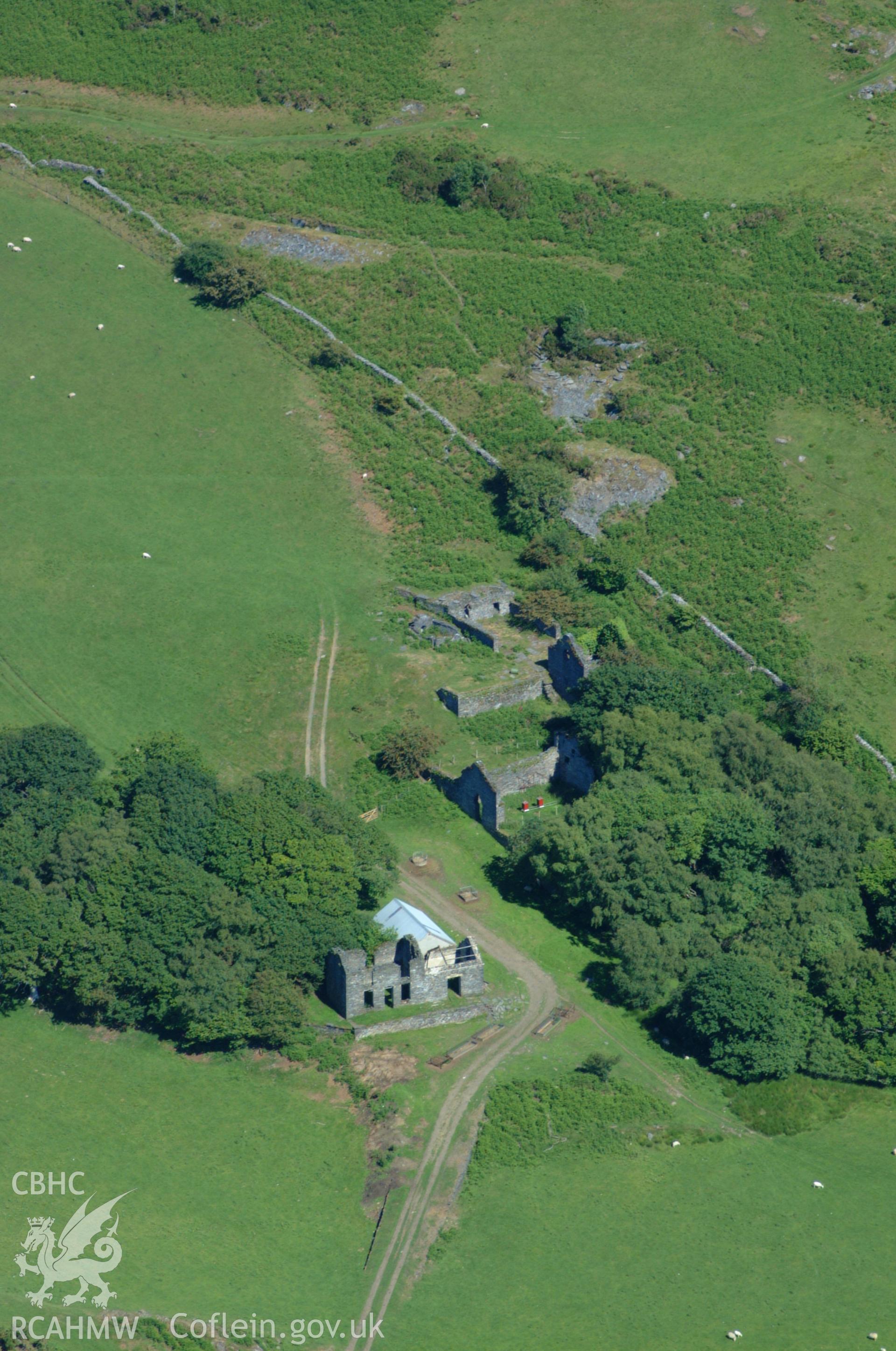 RCAHMW colour oblique aerial photograph of the mine office at Bryndyfi Lead Mine taken on 14/06/2004 by Toby Driver