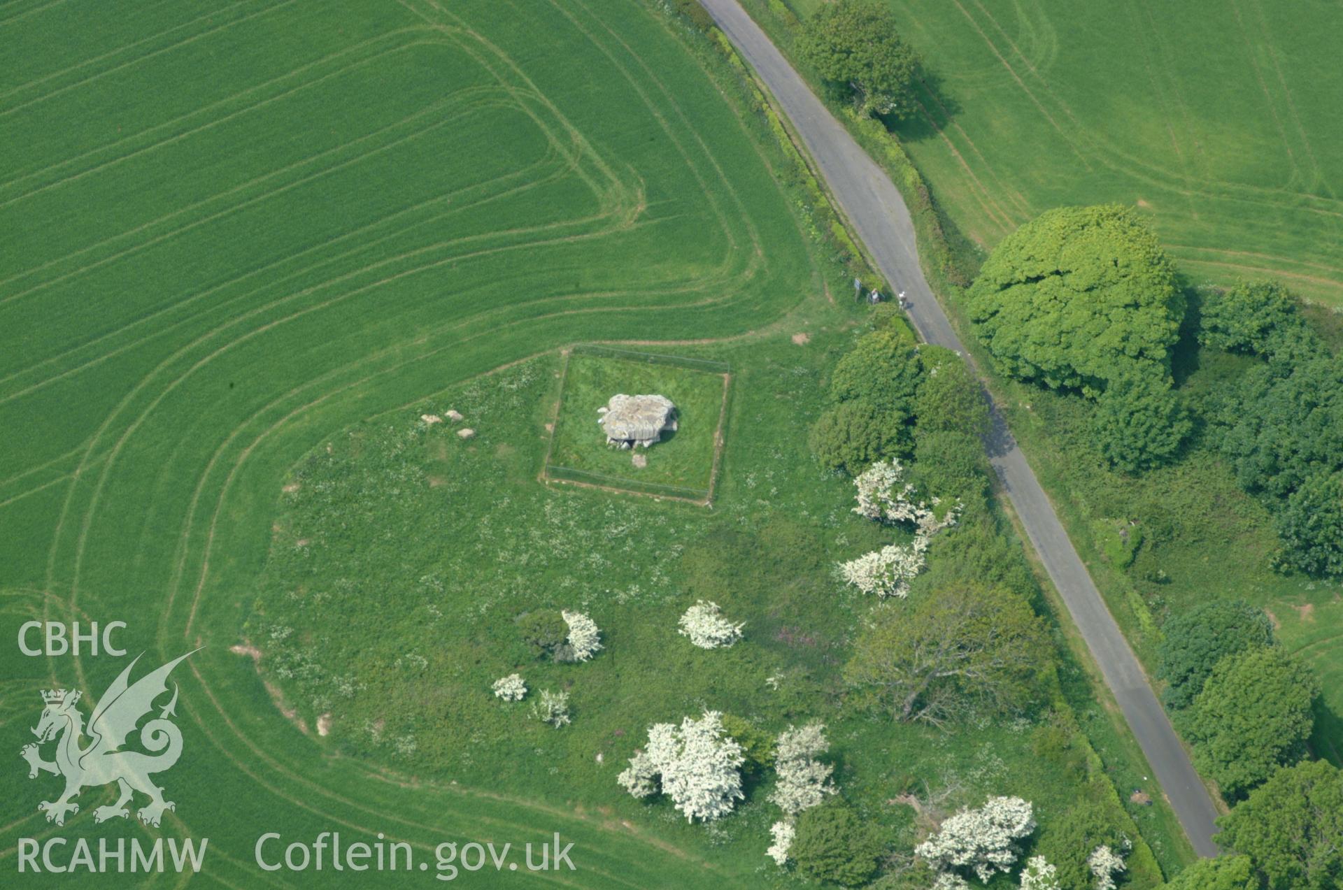 RCAHMW colour oblique aerial photograph of Lligwy Burial Chamber taken on 26/05/2004 by Toby Driver